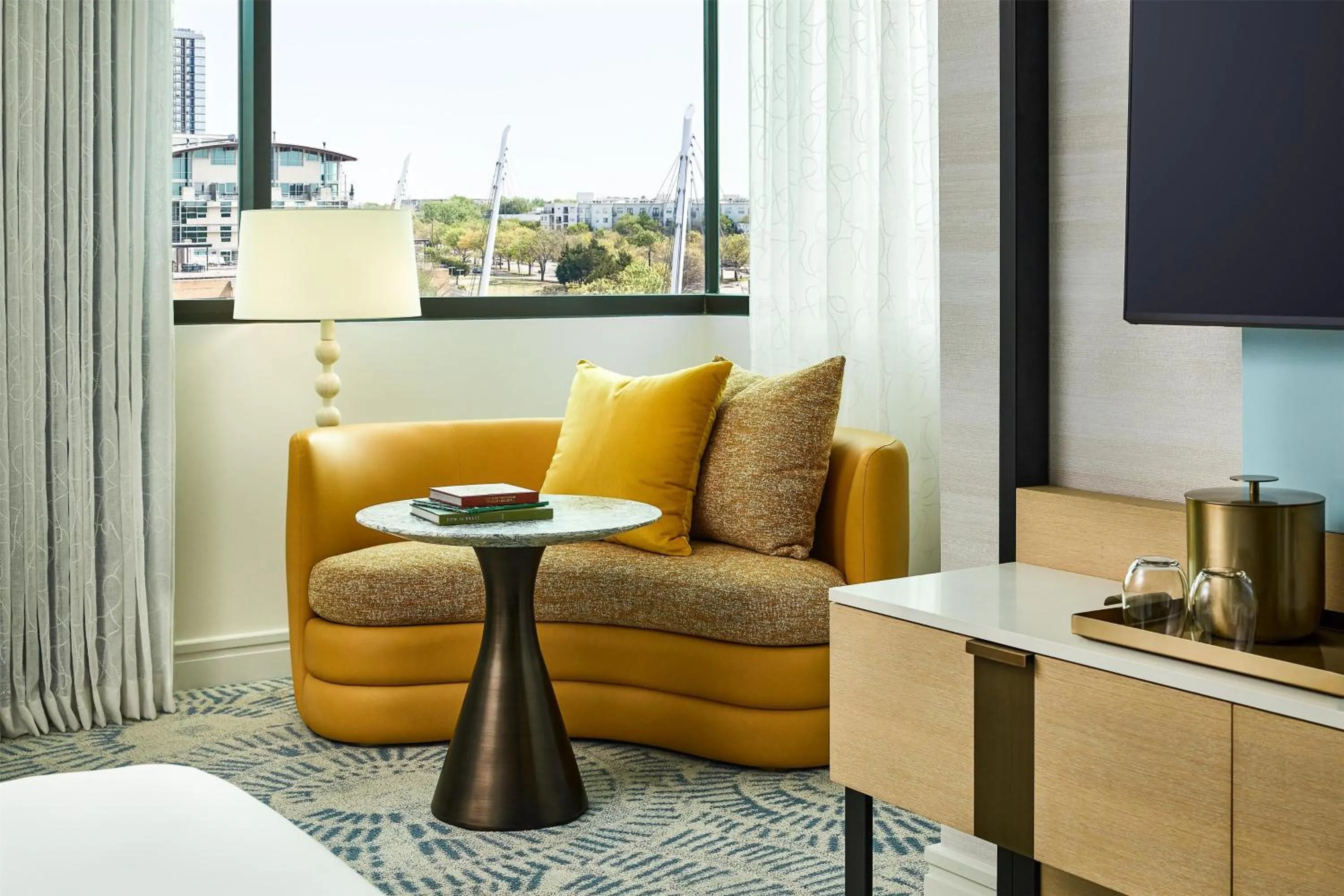 Living room in The Highland Dallas, Curio Collection by Hilton