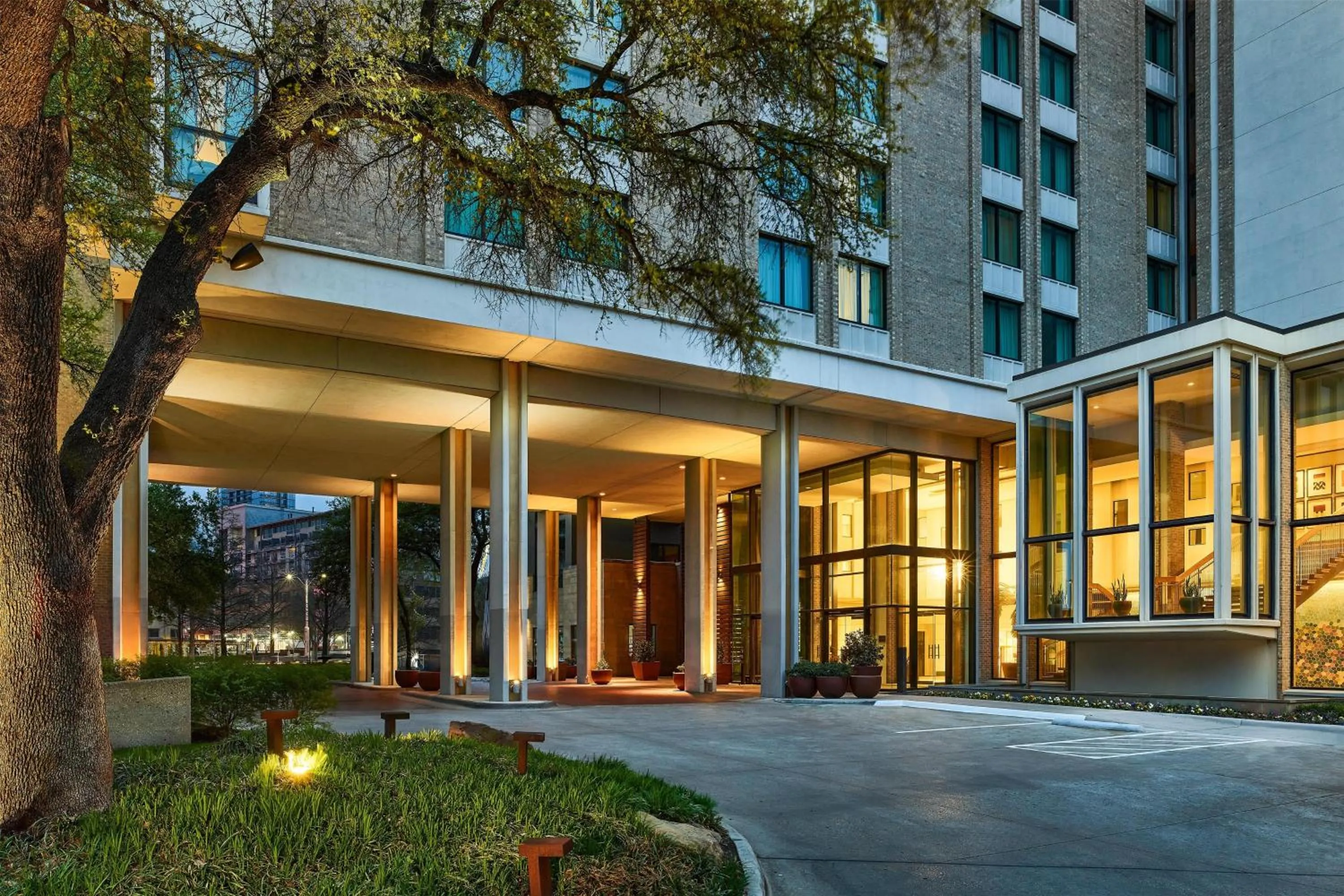 Property building in The Highland Dallas, Curio Collection by Hilton