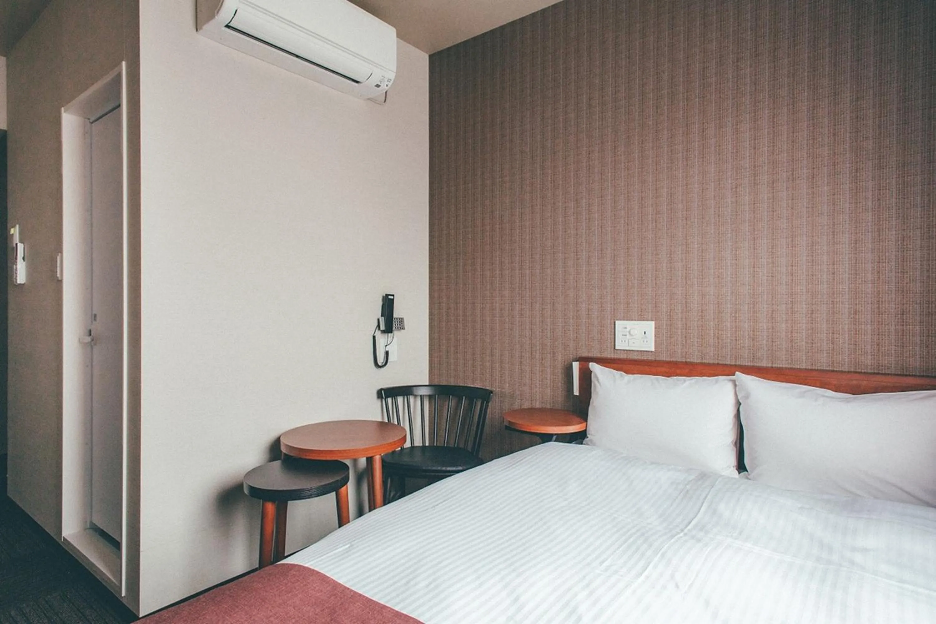 Bed in Hotel Kuretakeso Takayama Ekimae