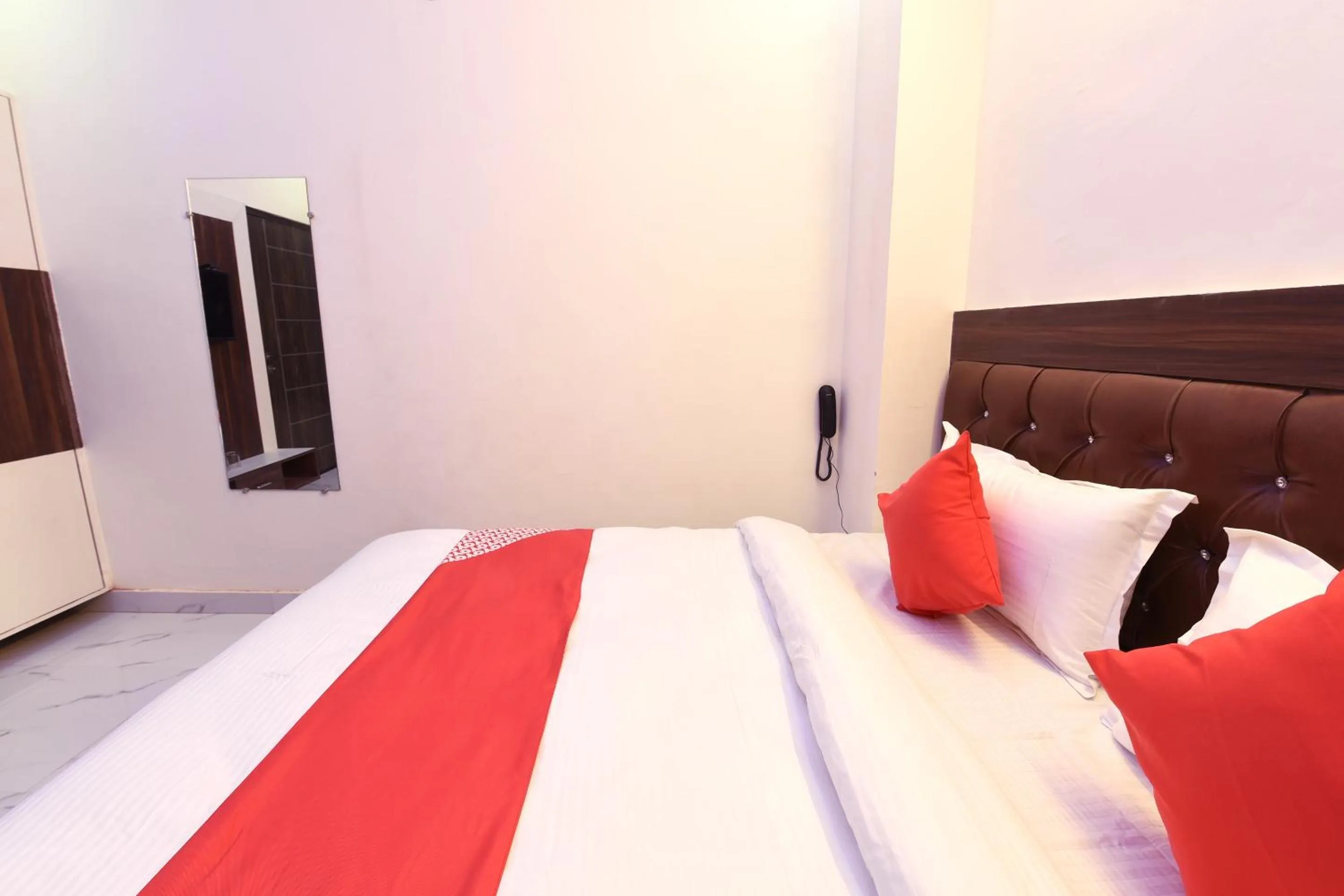 Bedroom in Hotel O The Signature Hotel Near Iskcon Temple Noida