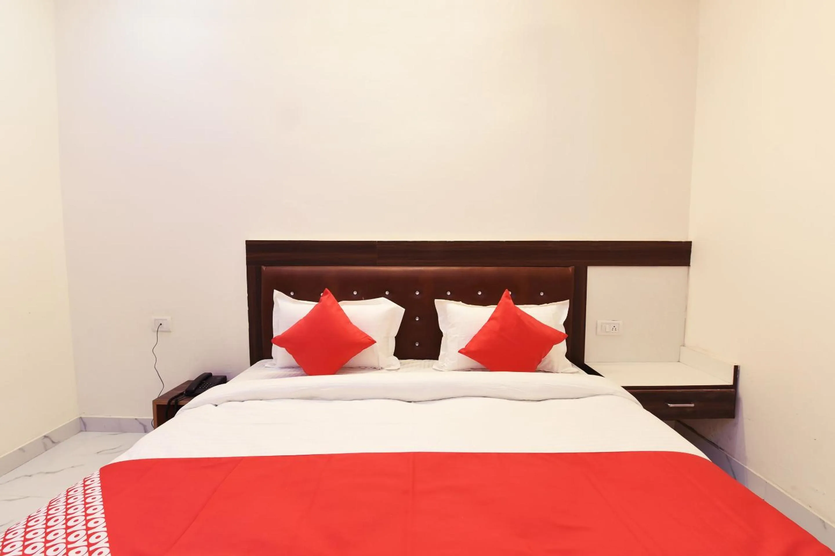 Bedroom in Hotel O The Signature Hotel Near Iskcon Temple Noida