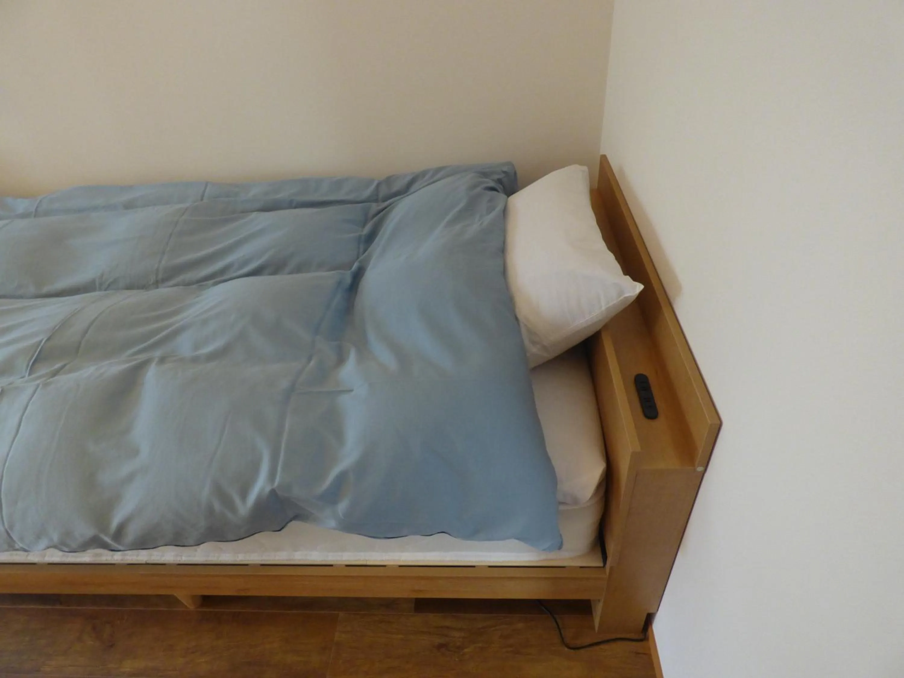 Bed in Guesthouse Hyakumanben Cross