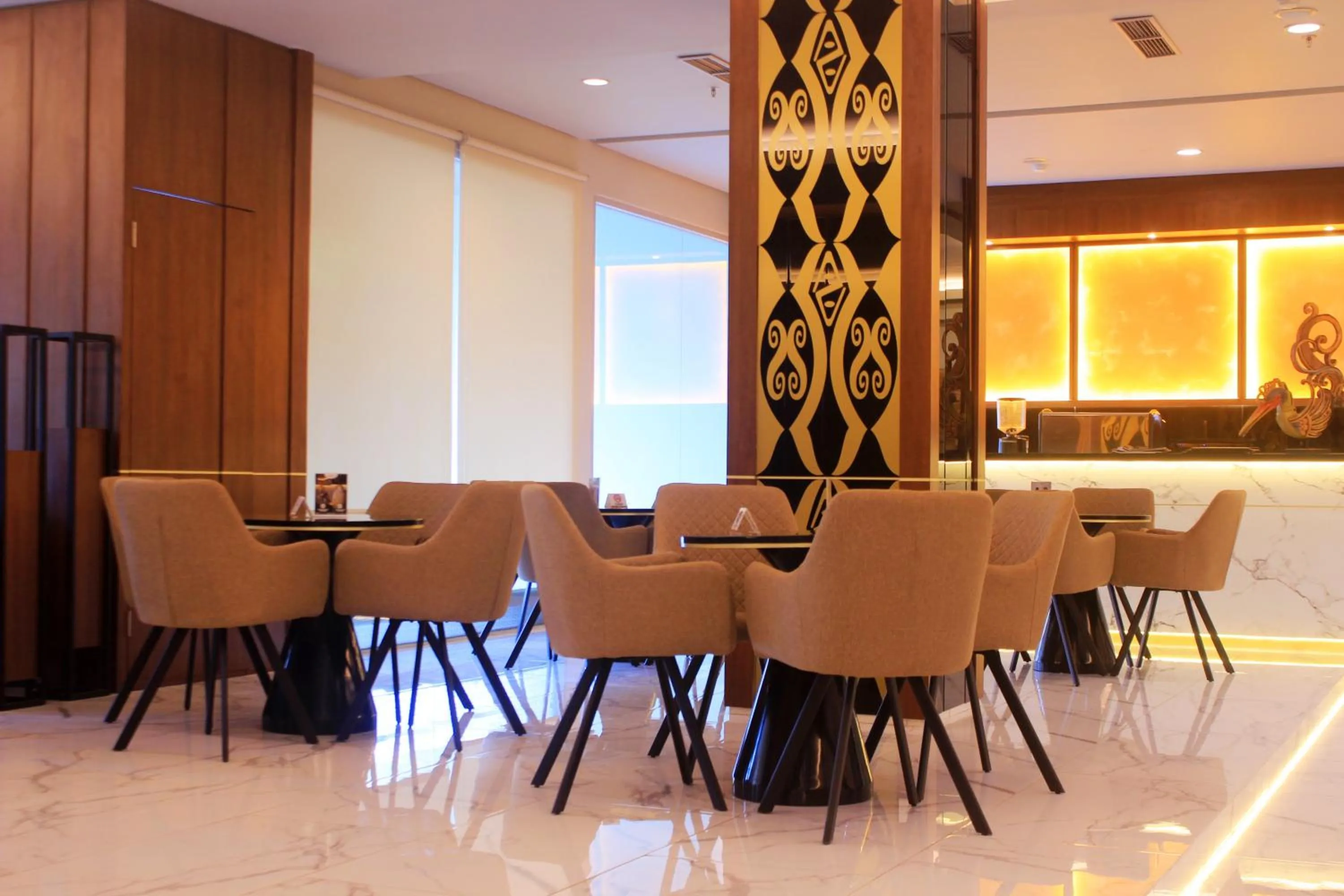 Communal lounge/ TV room in Swiss-Belexpress Jayapura