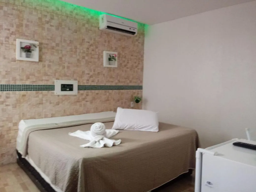 Bed in Hotel Cajuína City