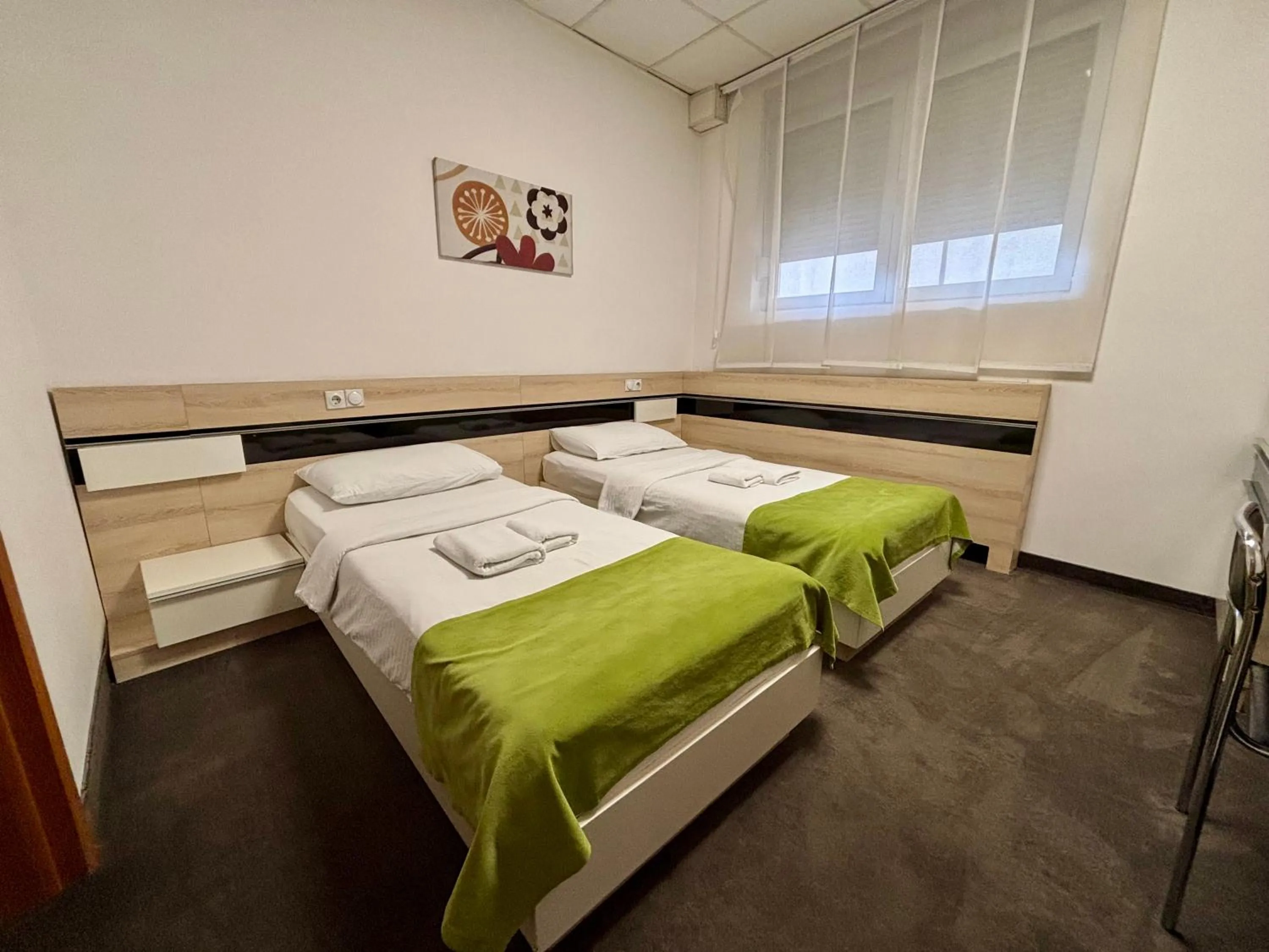 Bed in Garni Hotel Consul