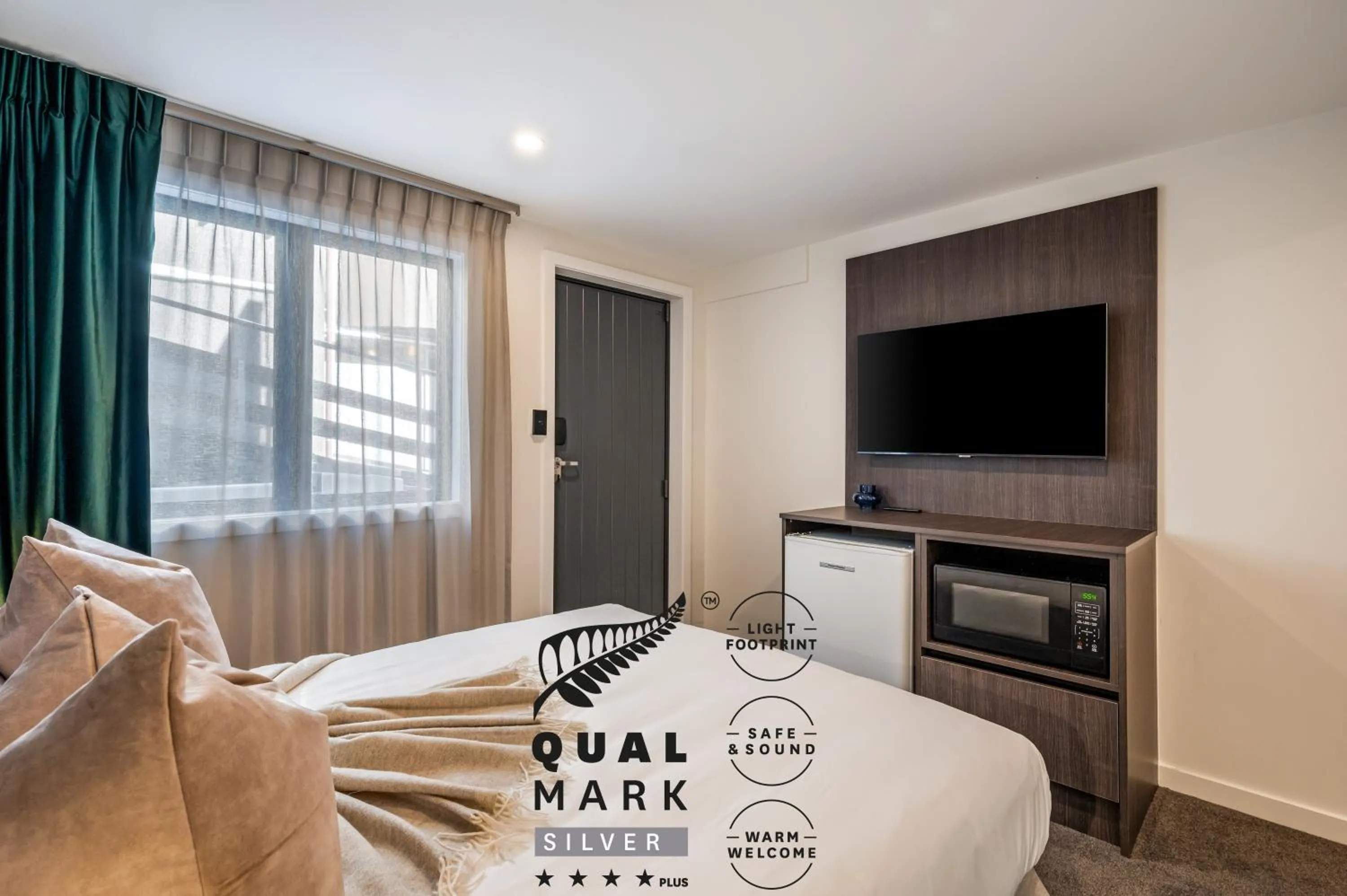 Bed in Luxe Suites & Apartments