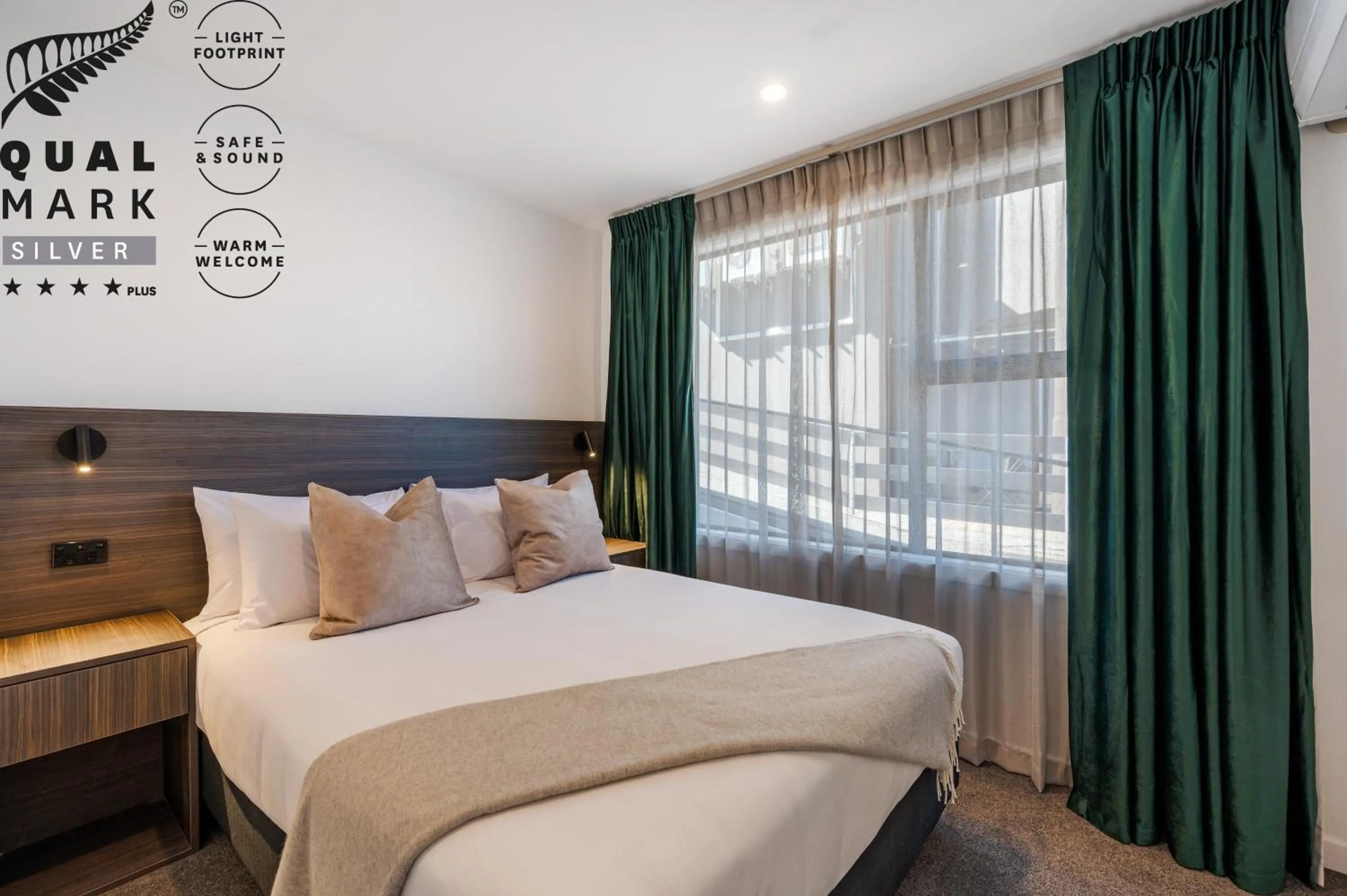 Bed in Luxe Suites & Apartments