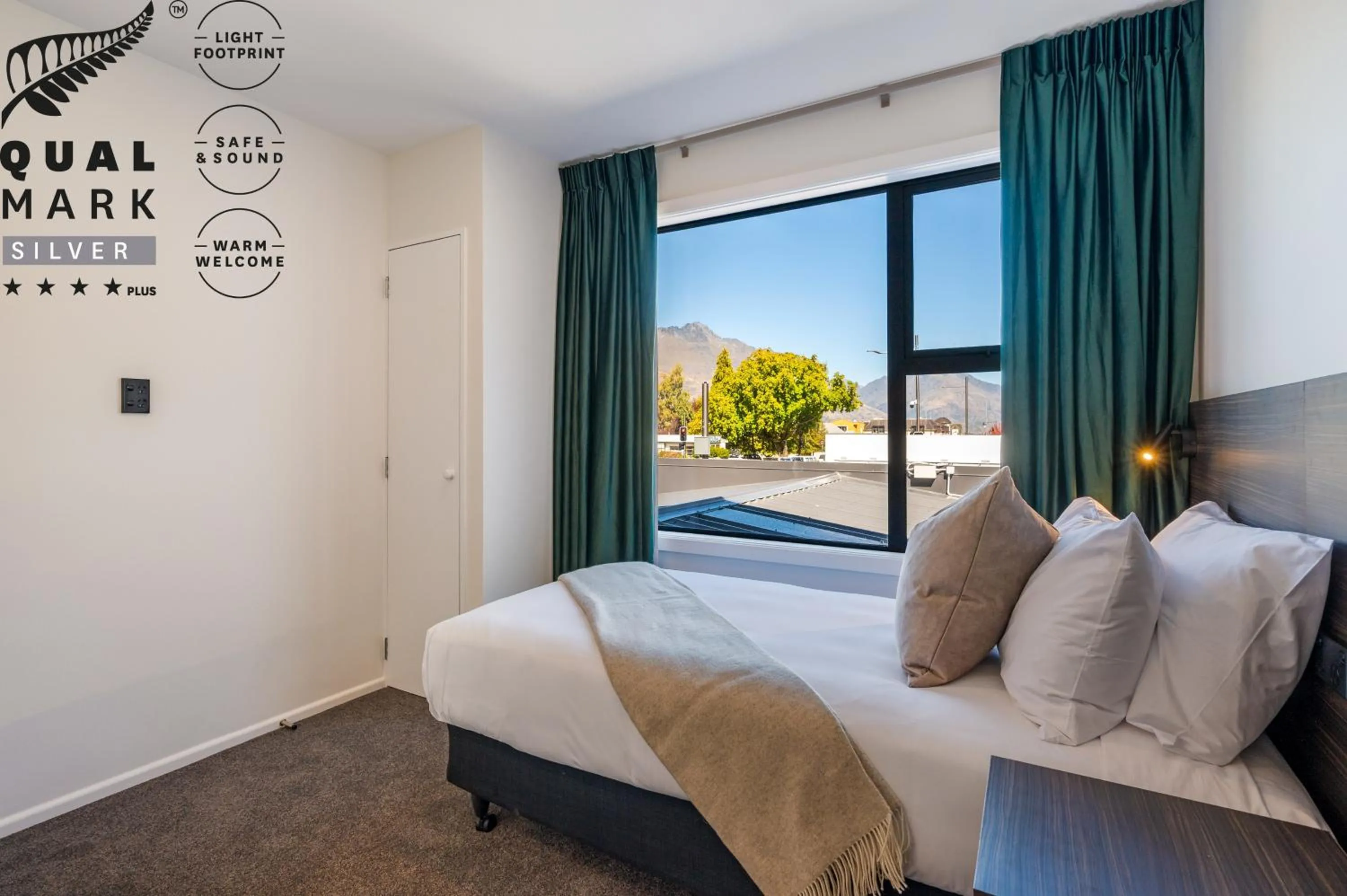 Bed in Luxe Suites & Apartments