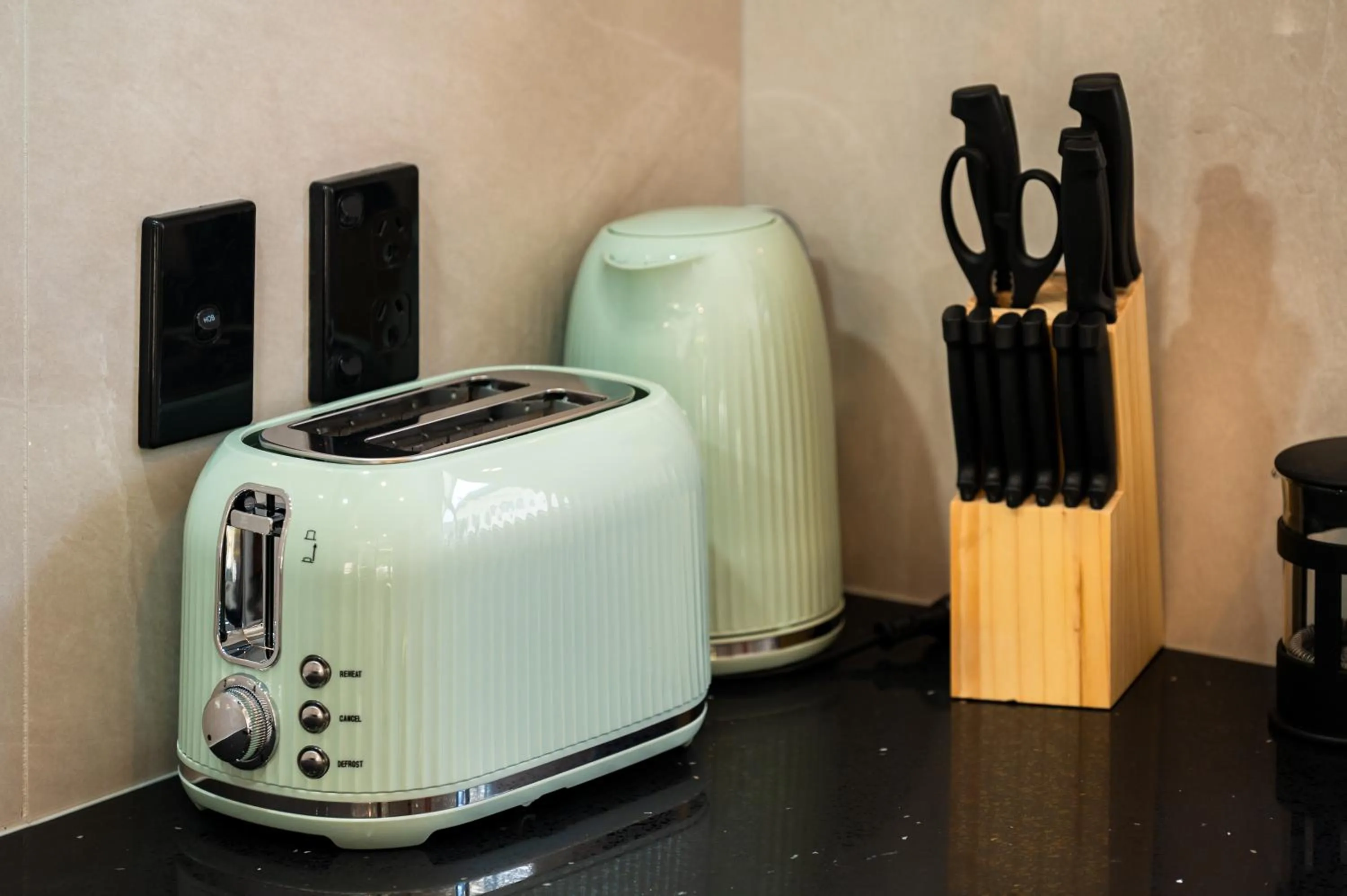 toaster in Luxe Suites & Apartments