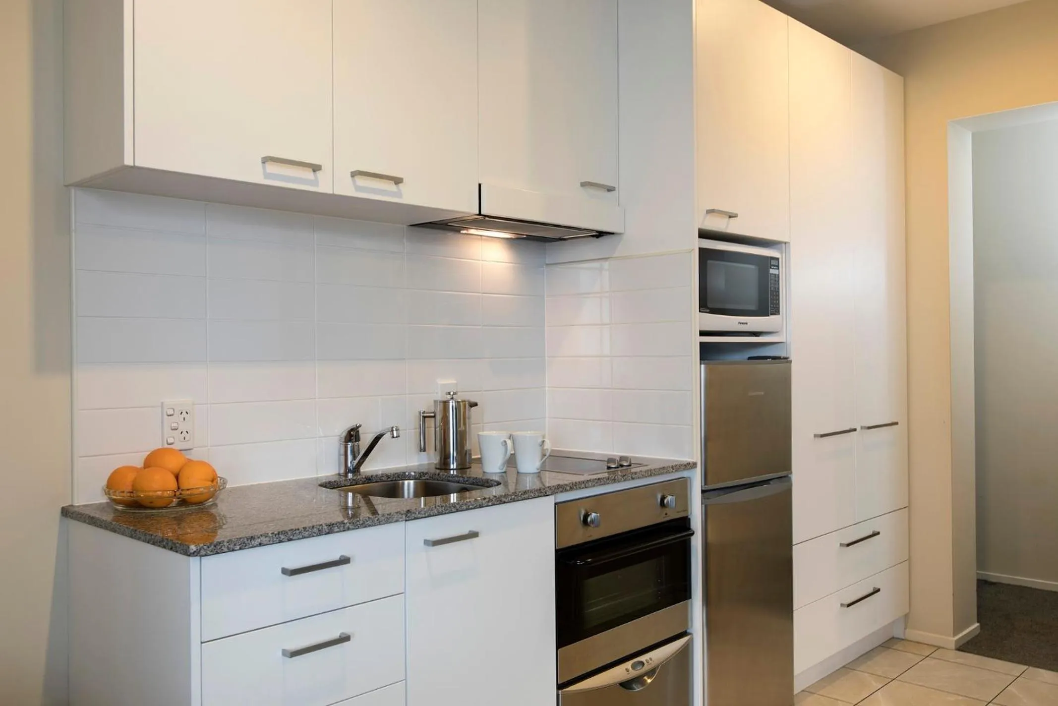 Kitchen or kitchenette in Quest on Queen Serviced Apartments