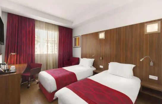 Bed in Ramada Encore By Wyndham Tangier