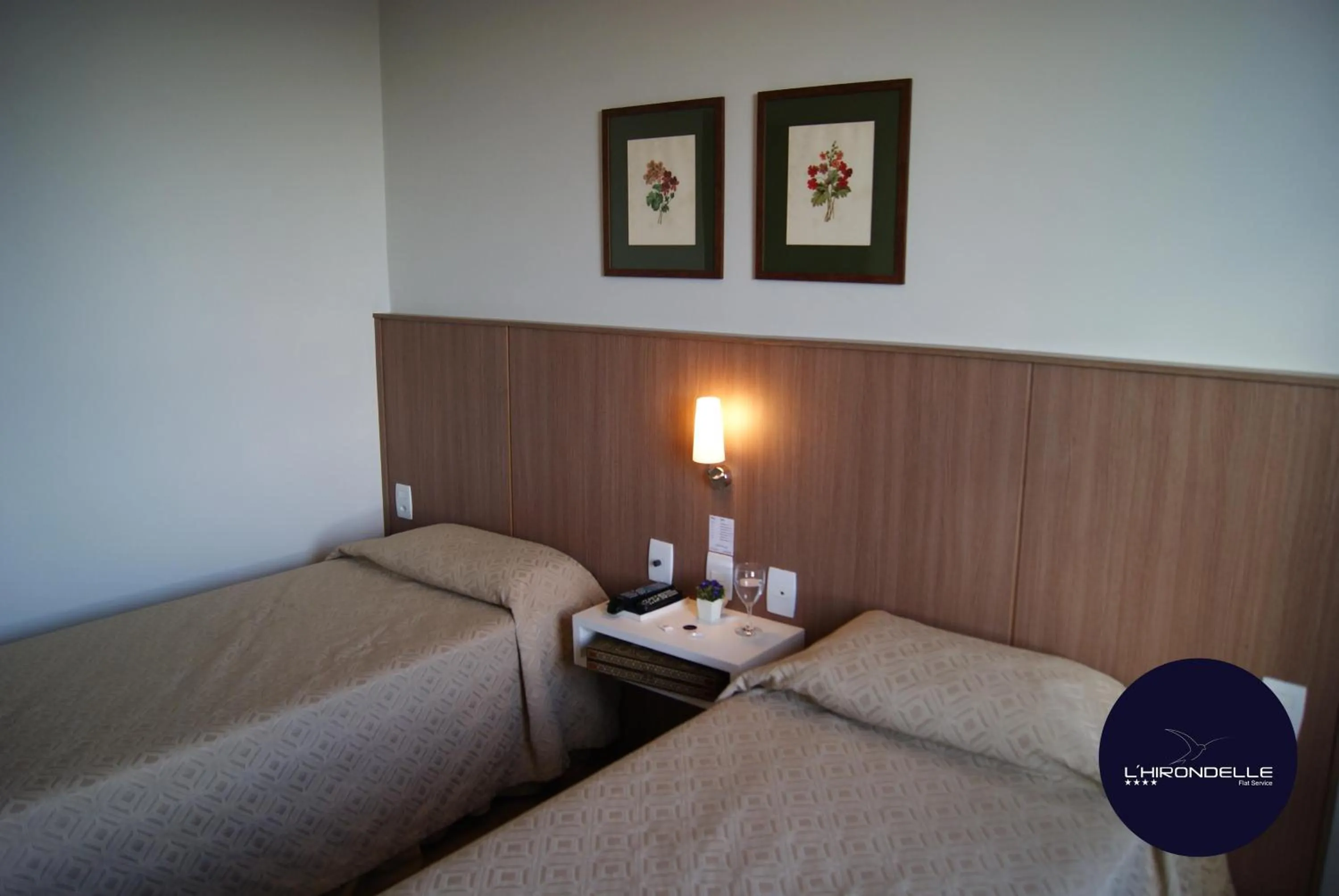 Bed in L'Hirondelle Flat Service