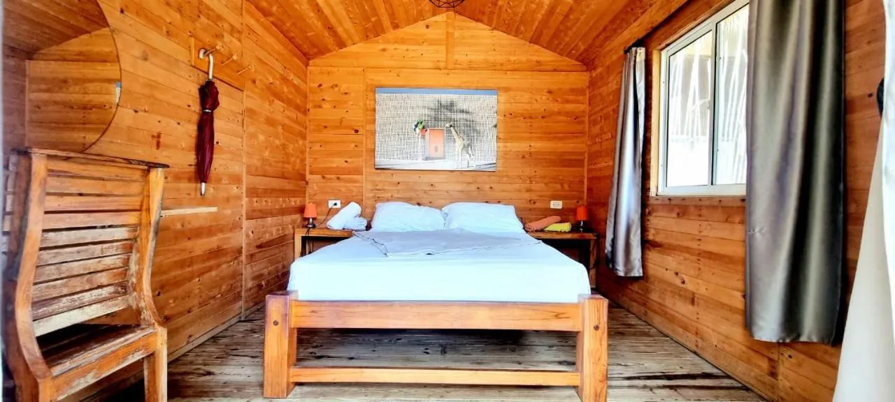 Bed in Blue Mango Beach Hotel