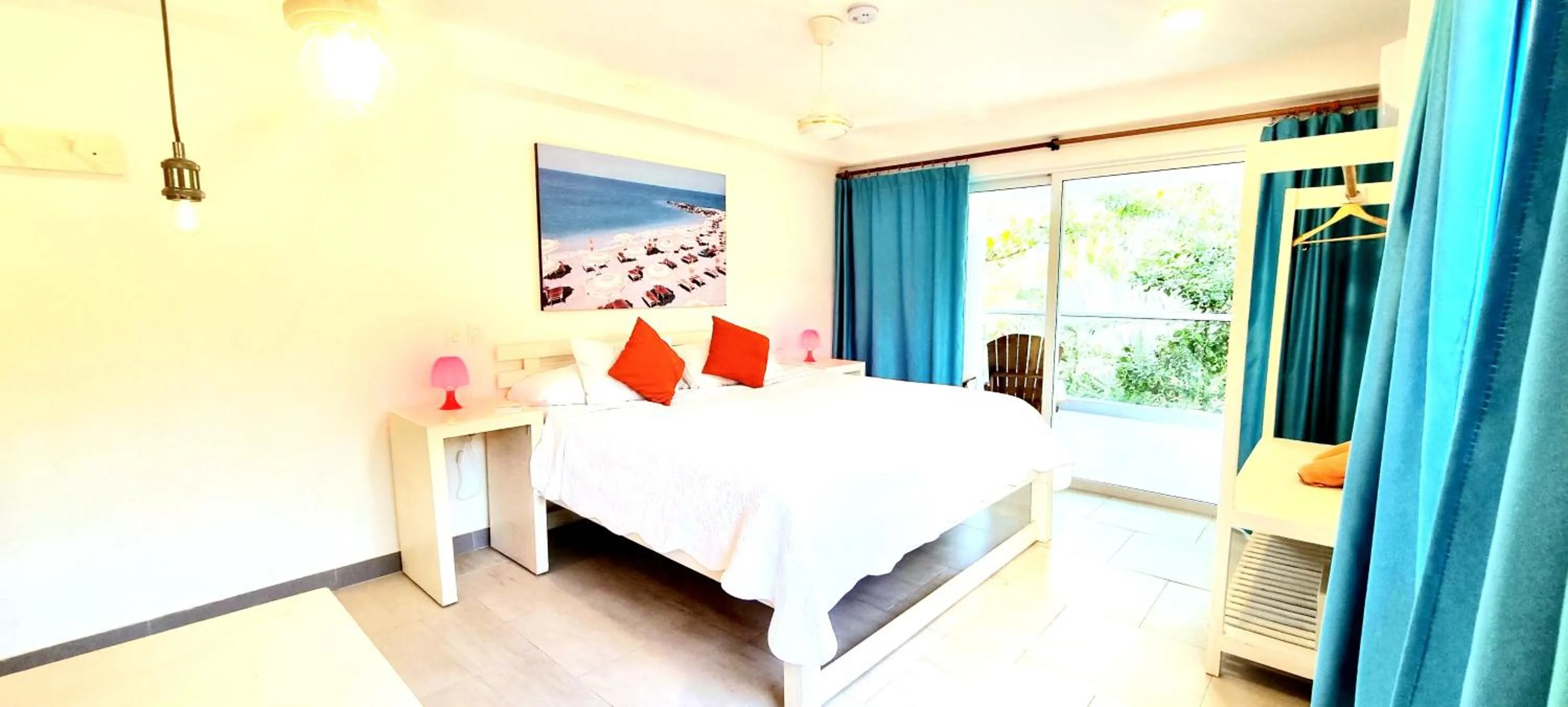 Bed in Blue Mango Beach Hotel