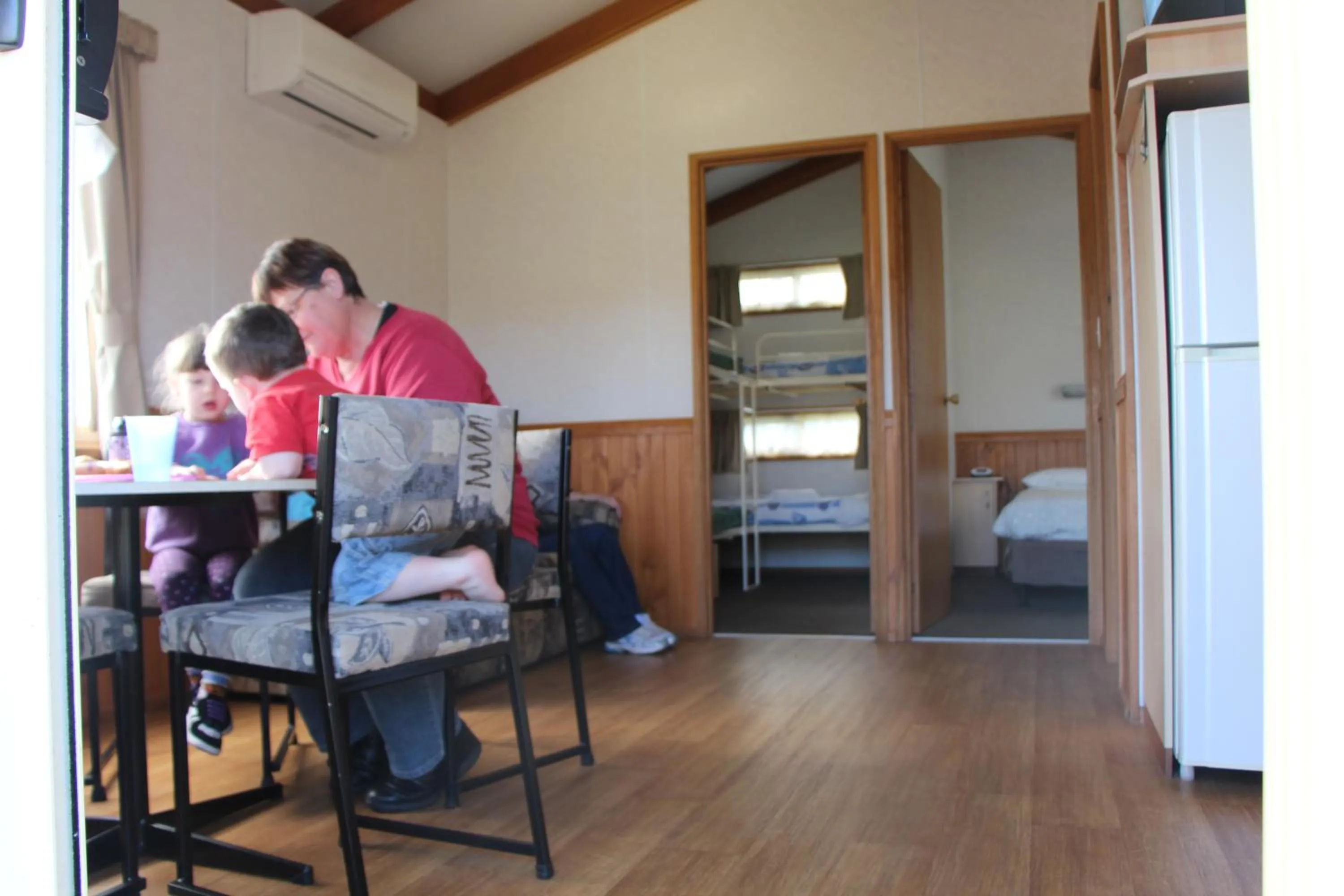 People, Bed in Warrnambool Motel and Holiday Park