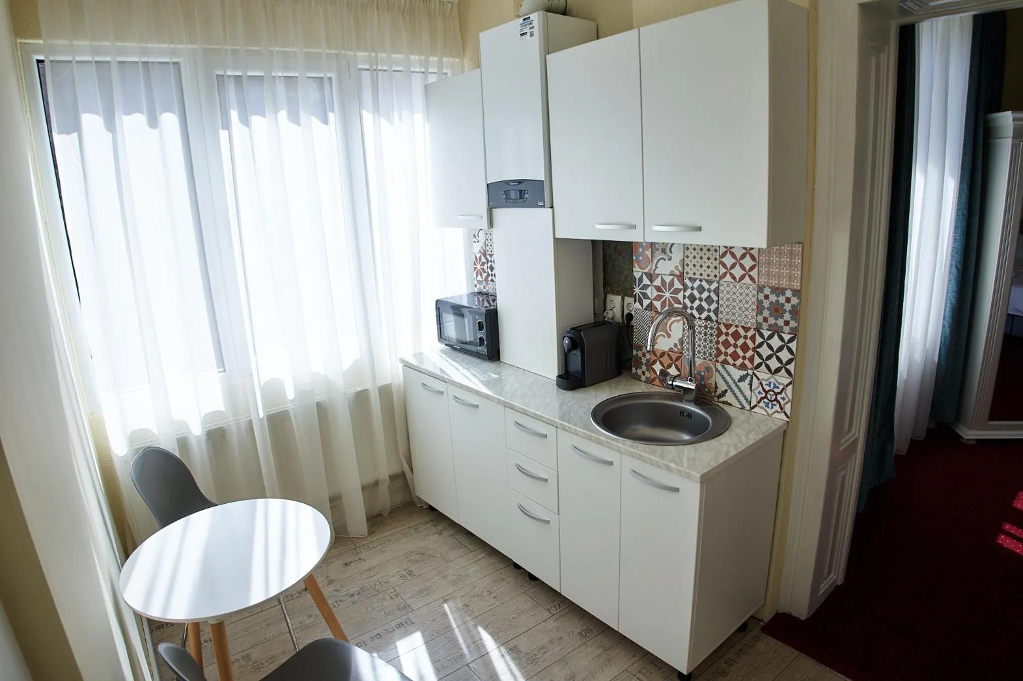 Kitchen or kitchenette in Charma Residence