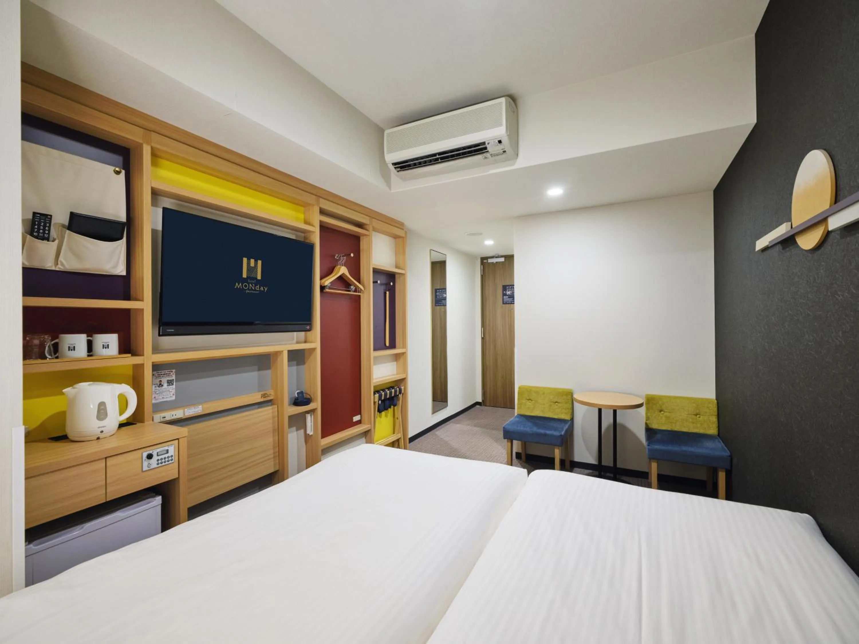 Bed in hotel MONday Tokyo Nishikasai