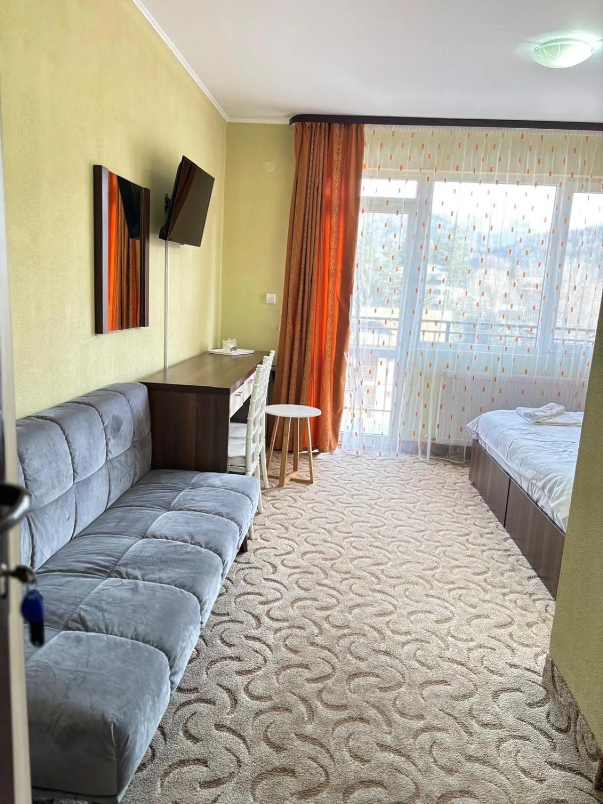 Communal lounge/ TV room, Bed in Hotel Iri