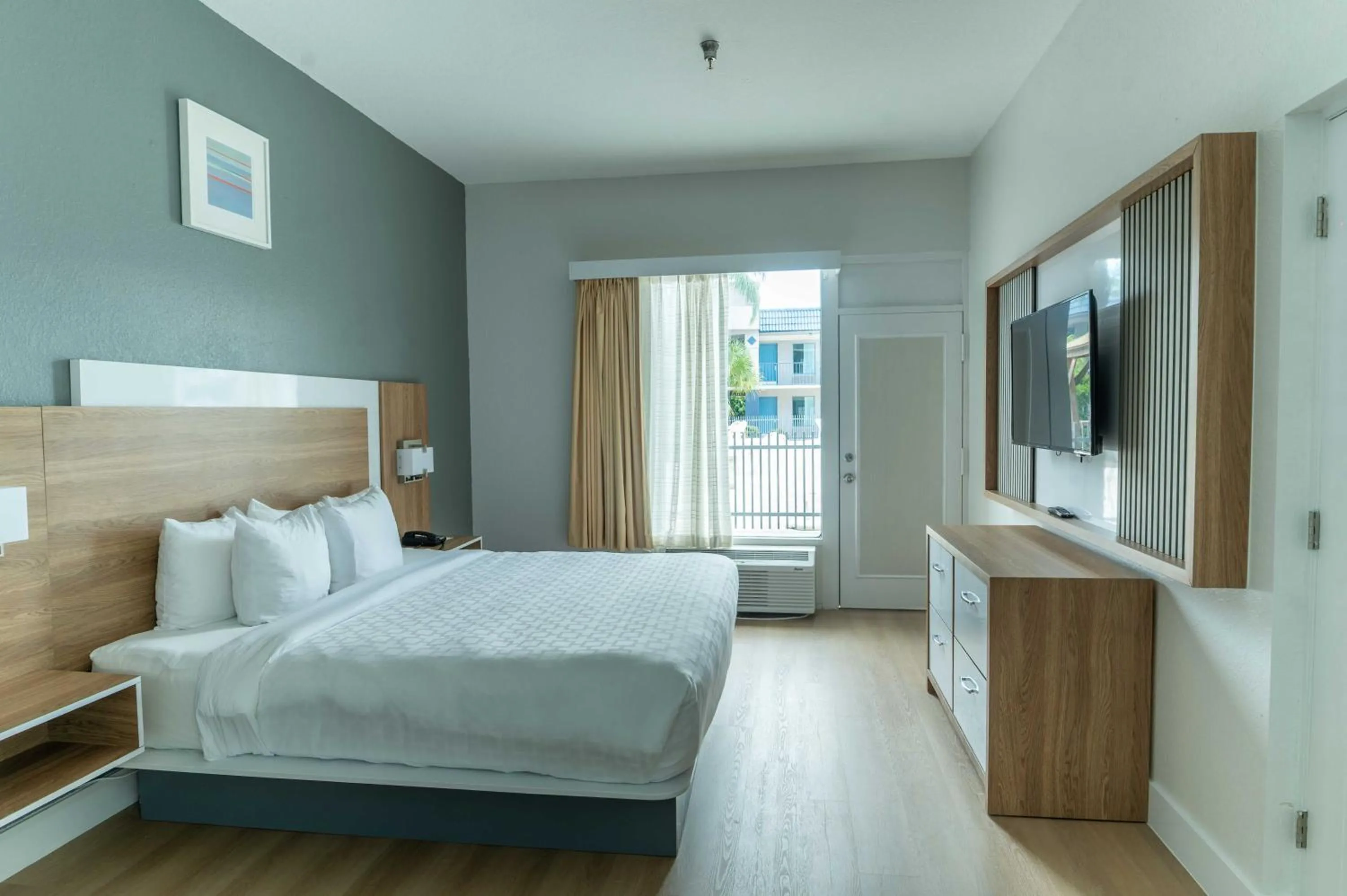 Bed in Clarion Inn & Suites Central Clearwater Beach