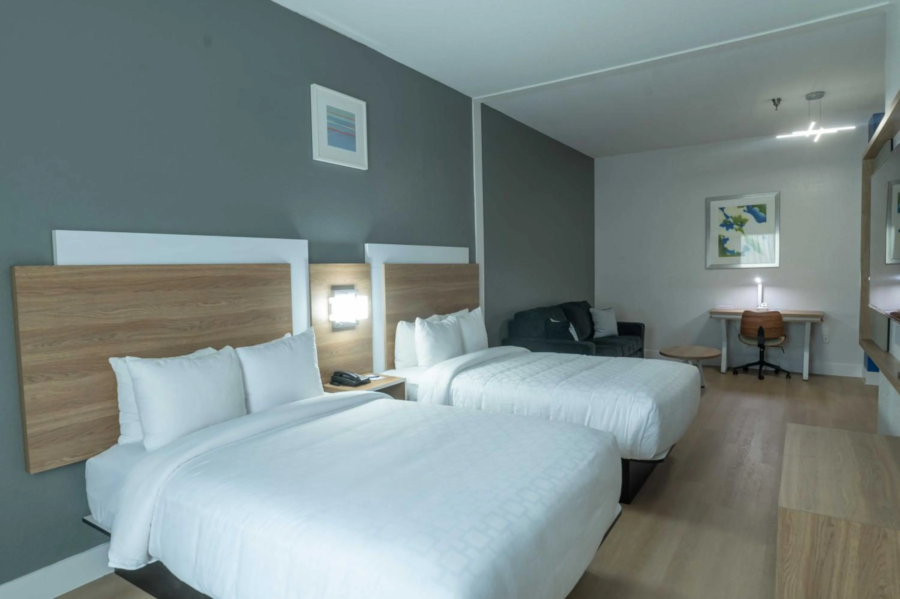 Bed in Clarion Inn & Suites Central Clearwater Beach