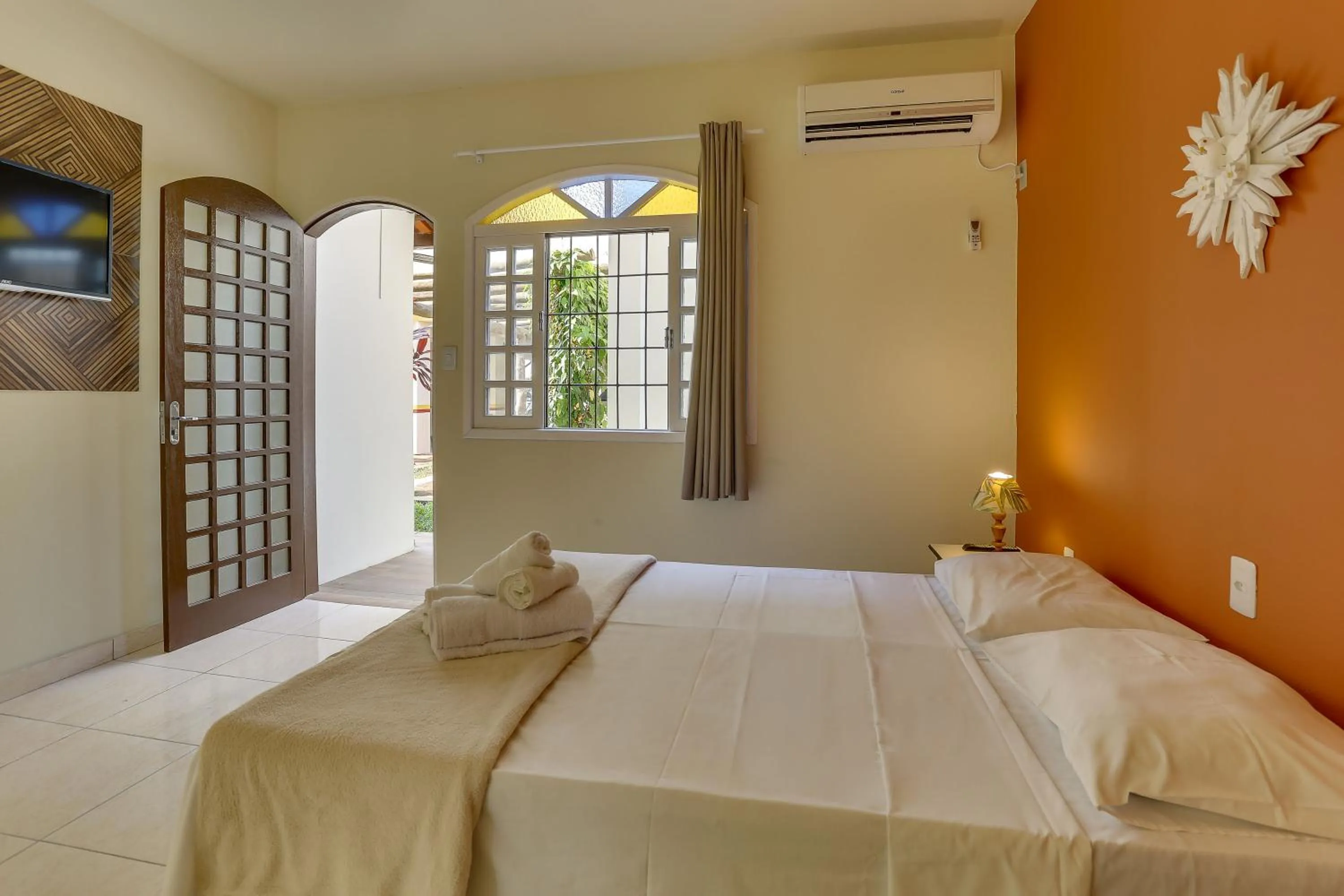 Bed in Pousada Carolina