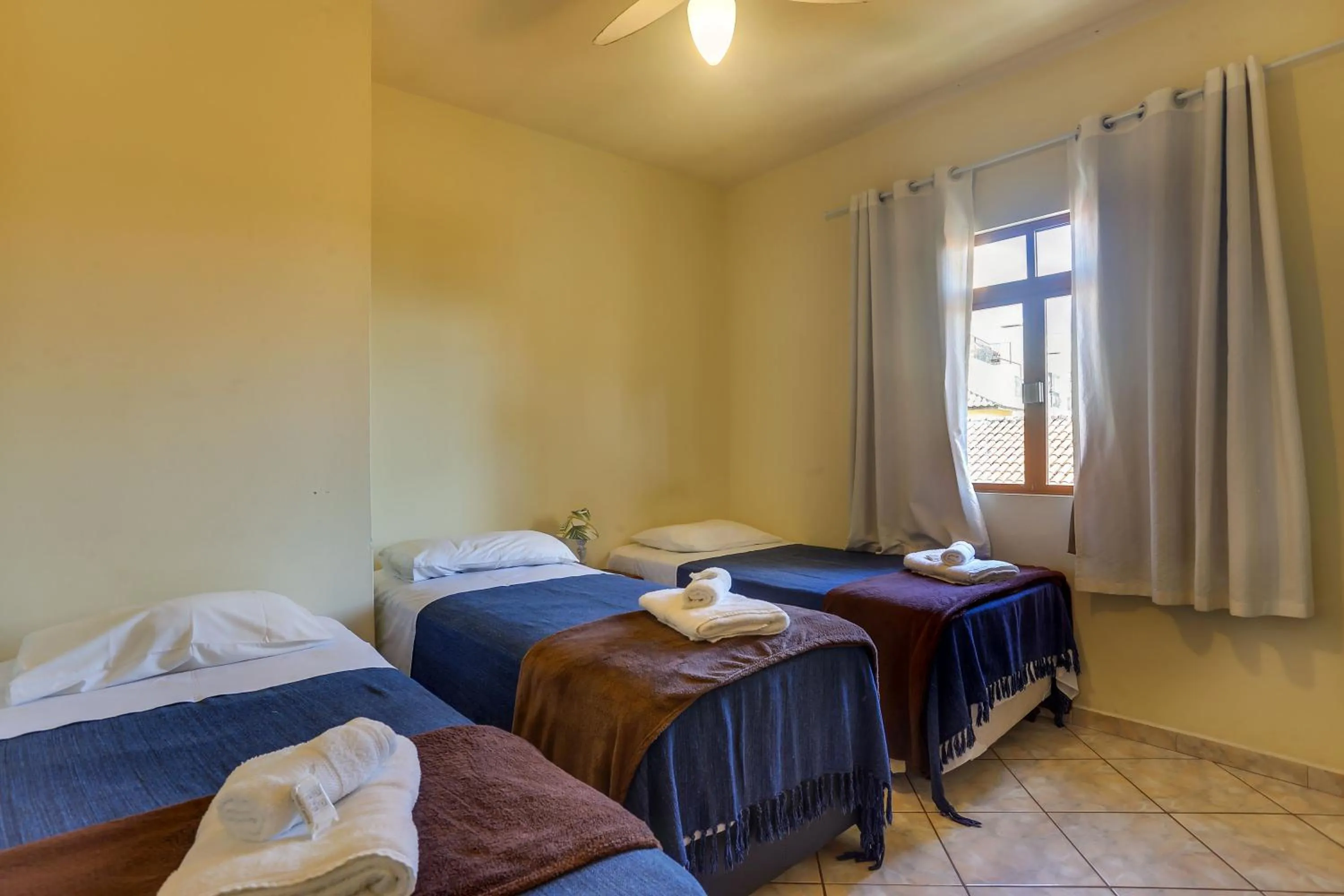 Bed in Pousada Carolina