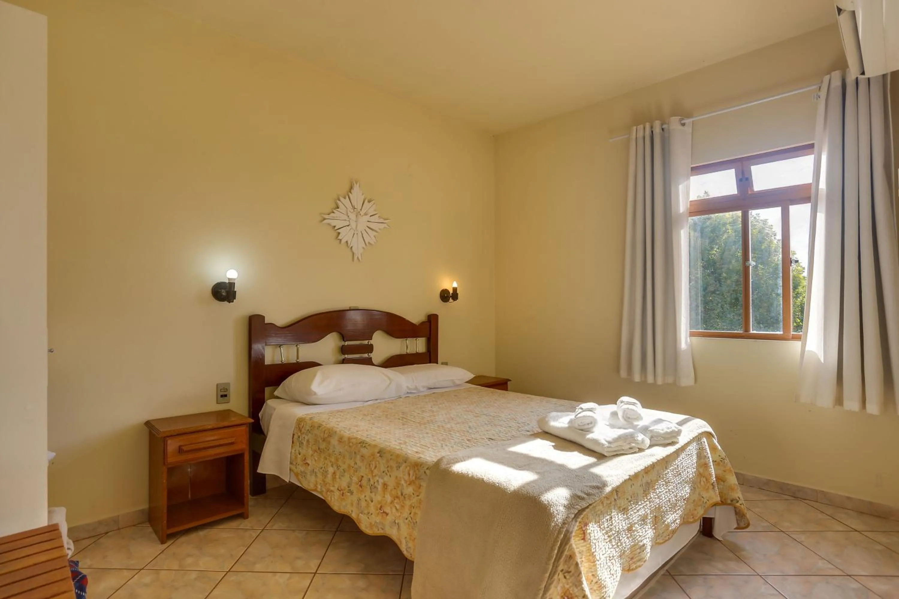 Bed in Pousada Carolina