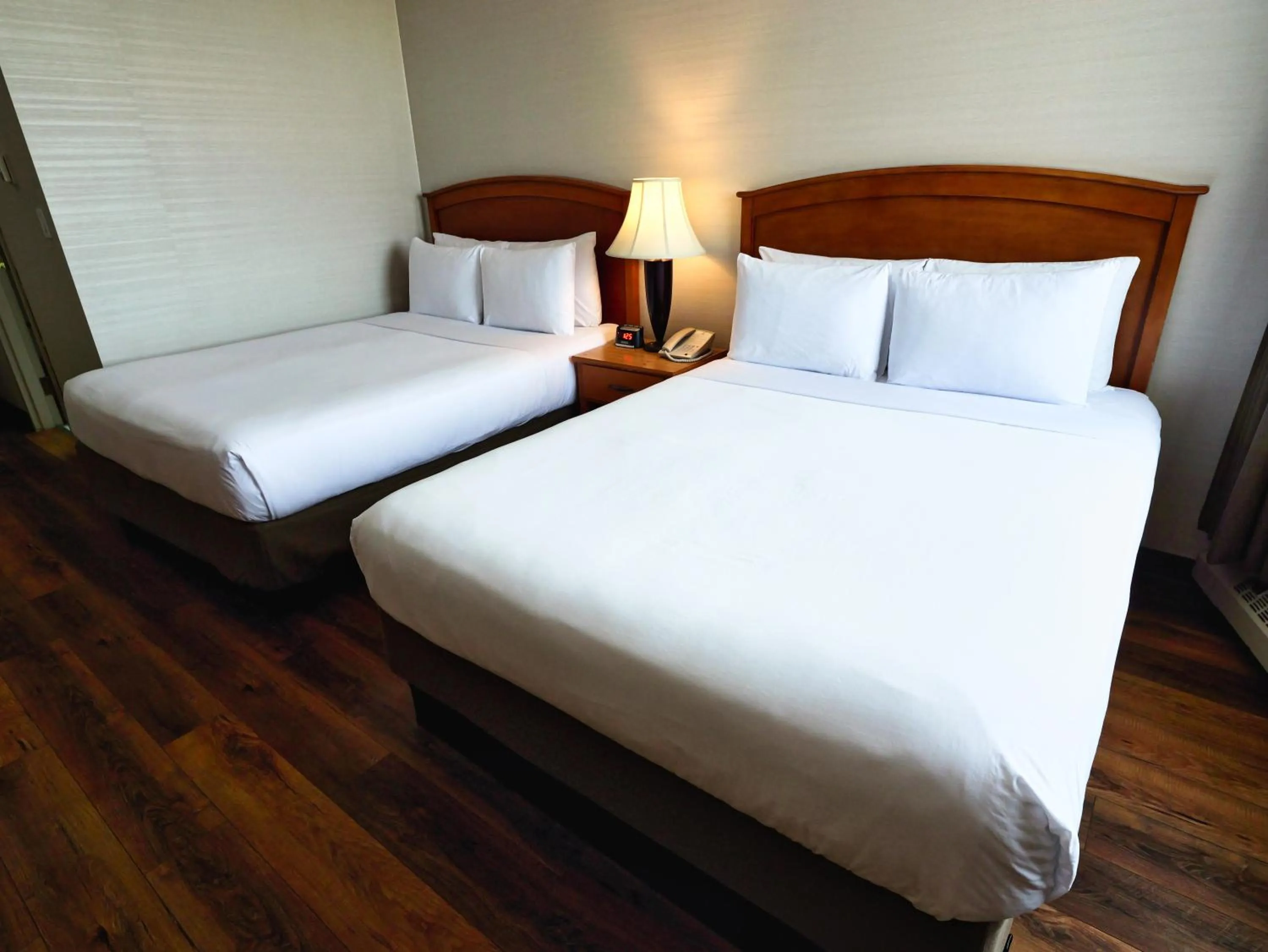 Bed in Continental Inn & Suites