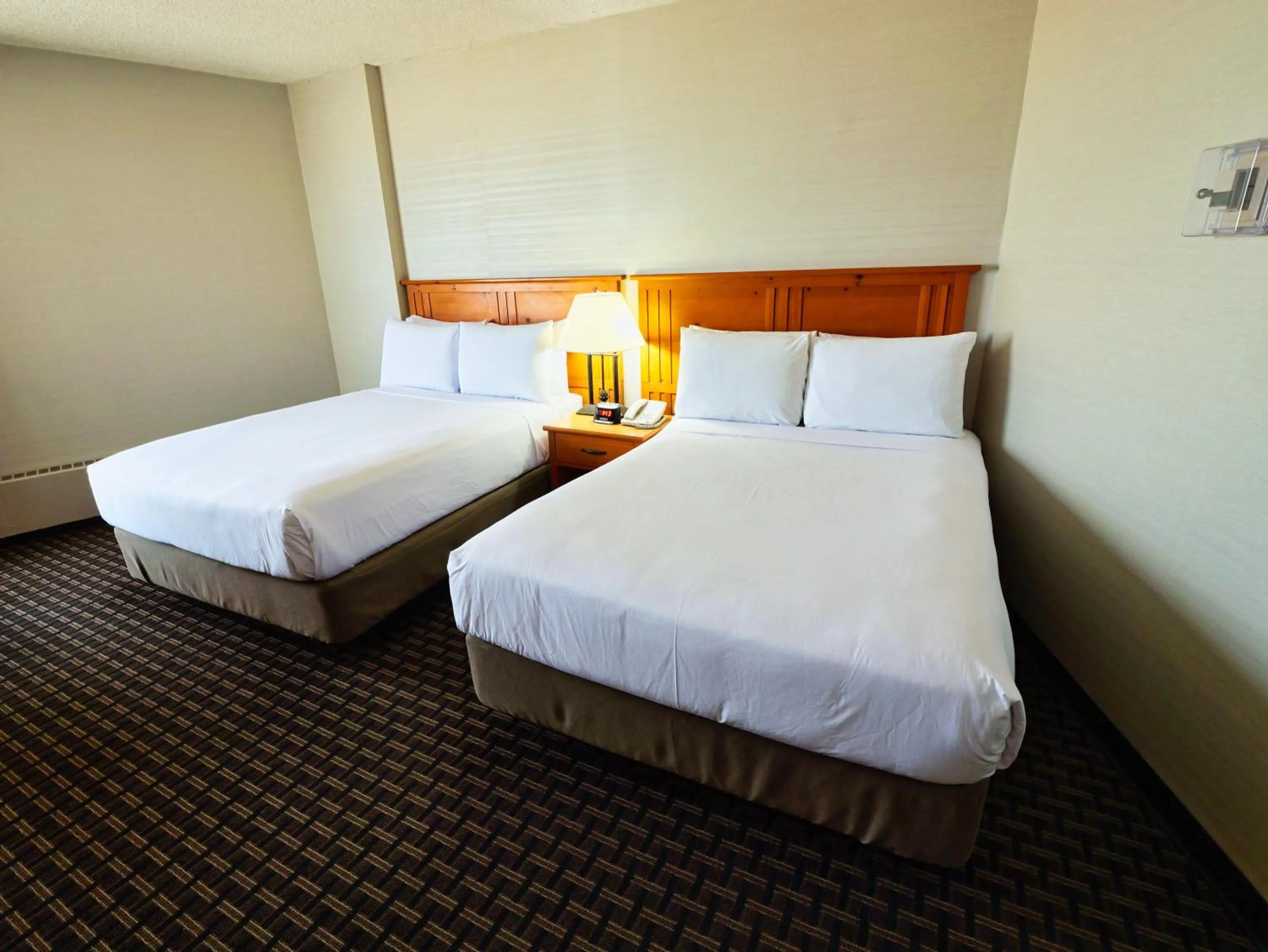 Bed in Continental Inn & Suites