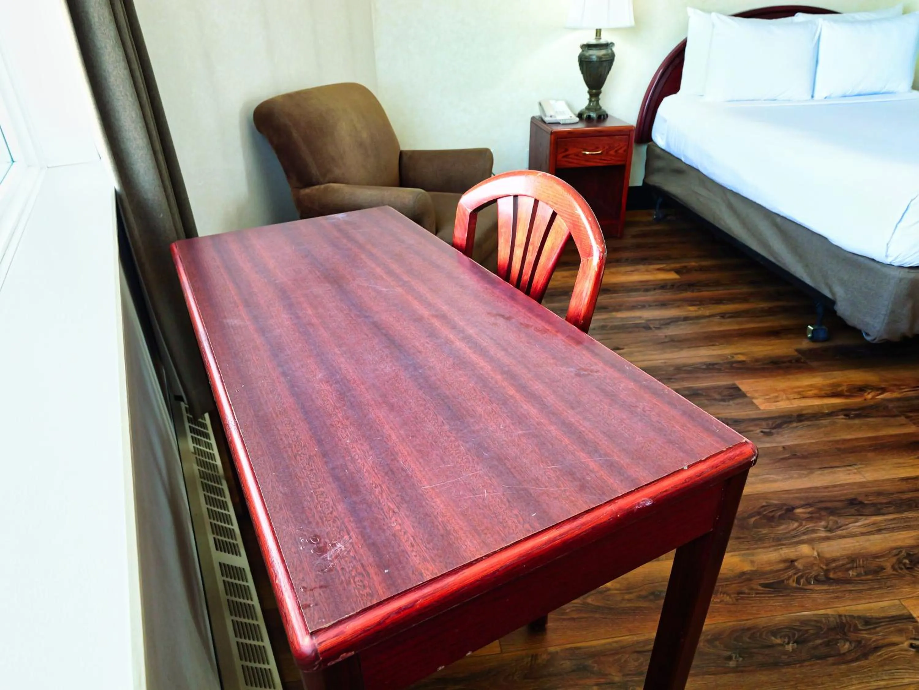 Bed in Continental Inn & Suites