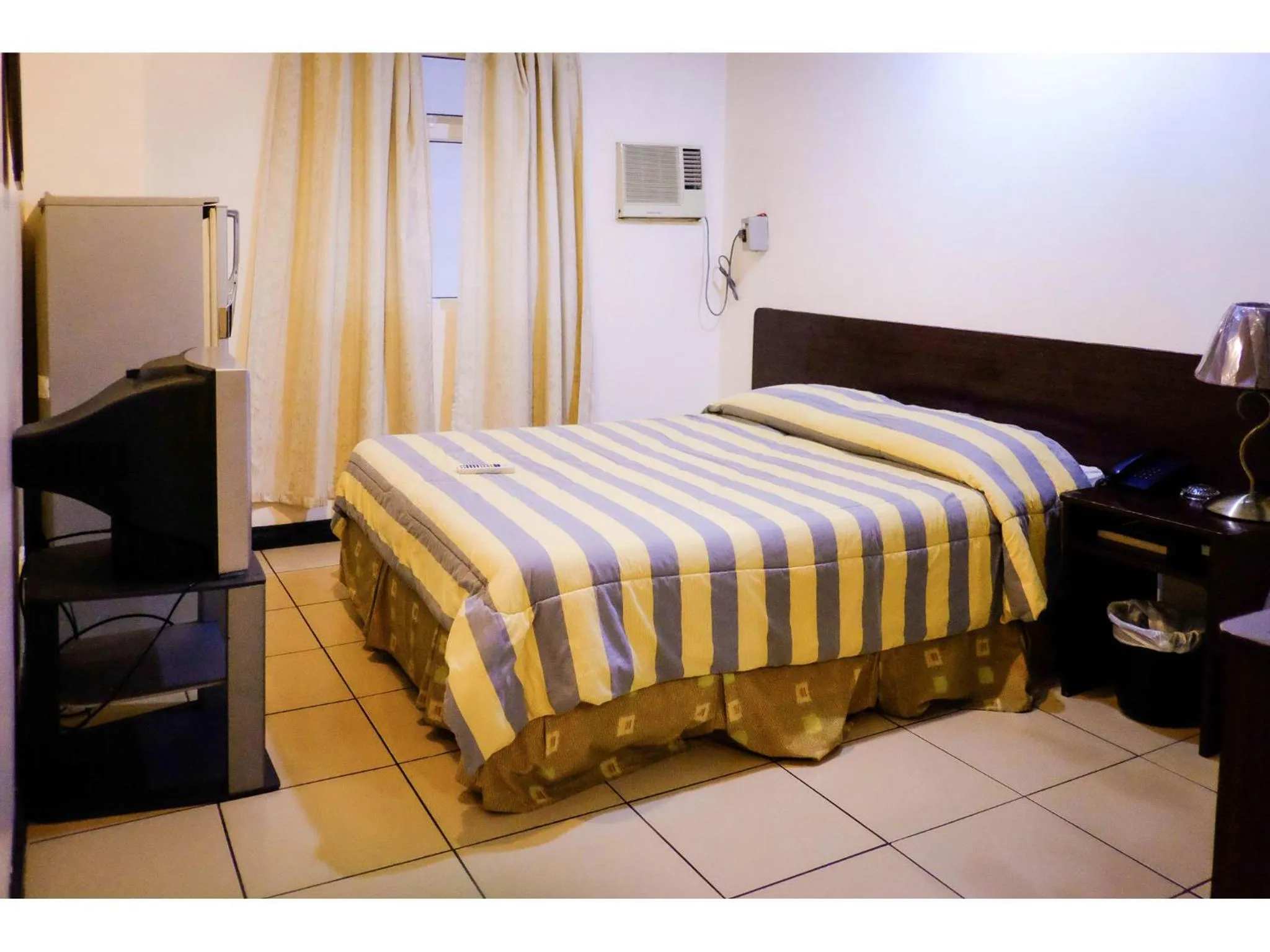 Bed in Crowne Garden Hotel