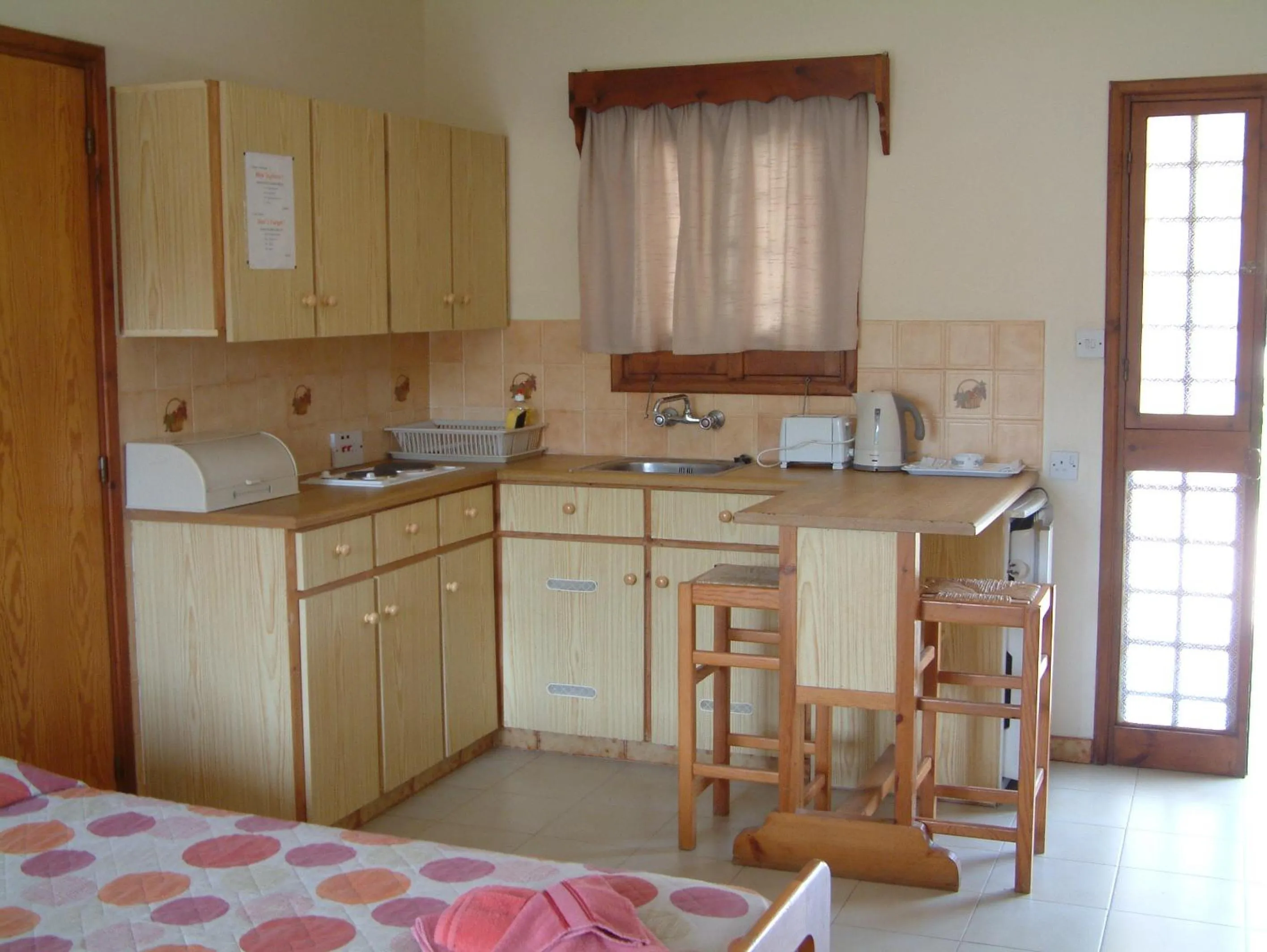 Kitchen or kitchenette in Pelekanos Apartments