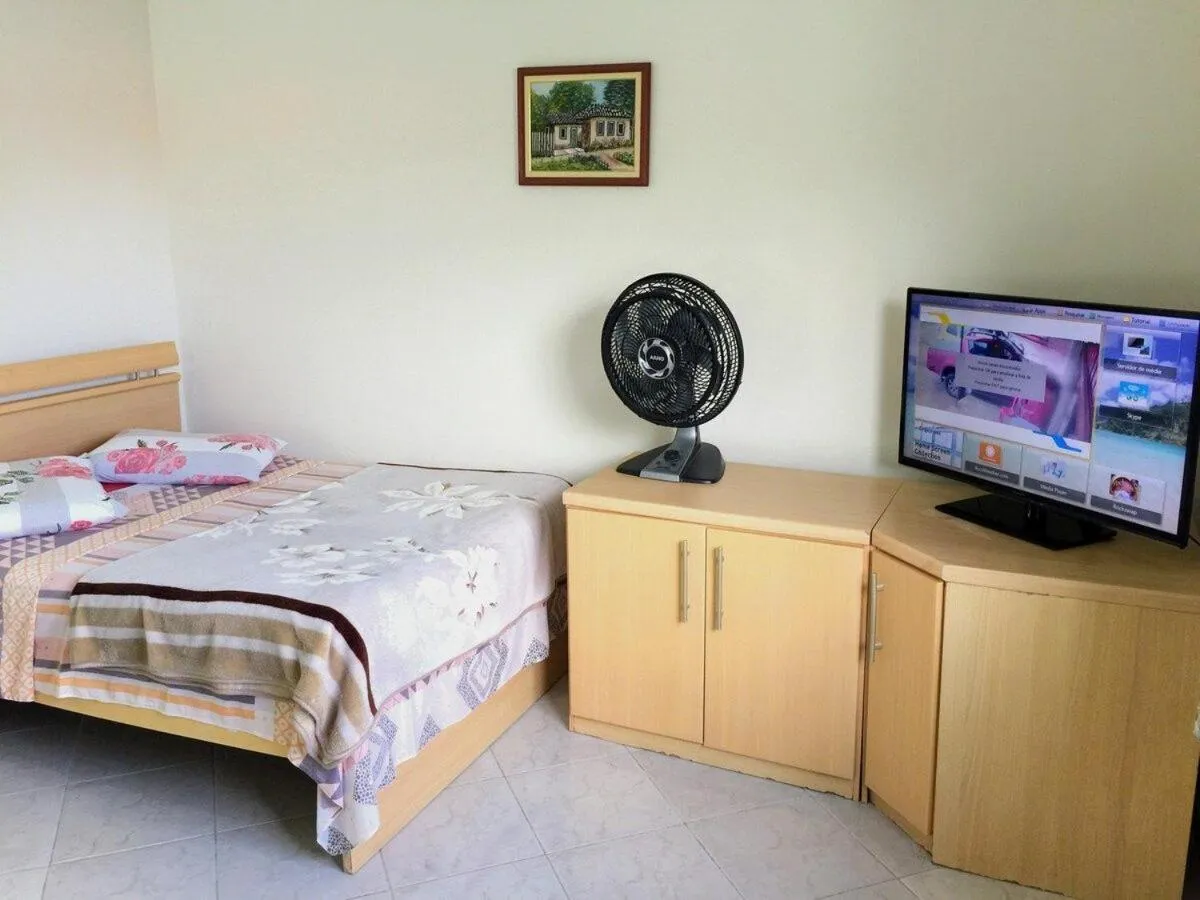 Bed in Pousada Souza