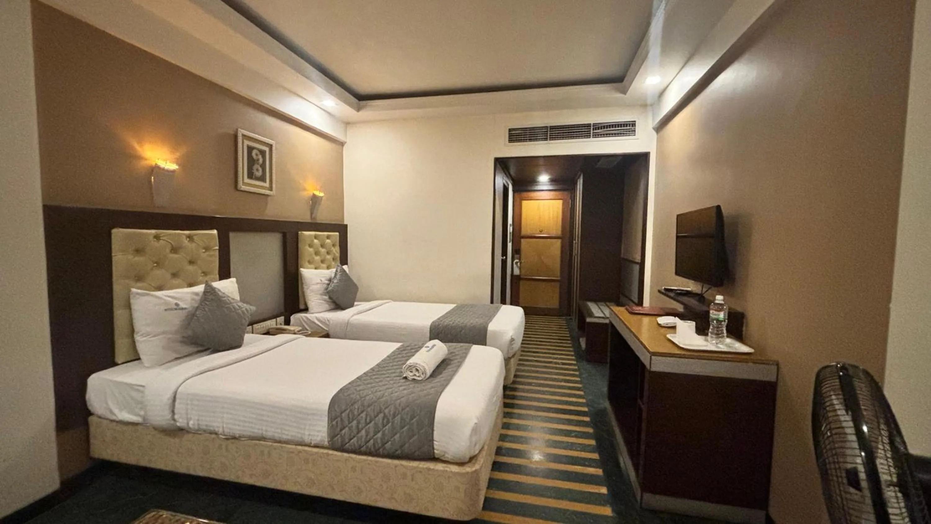 Bed in Hotel Dr Rajkumar International