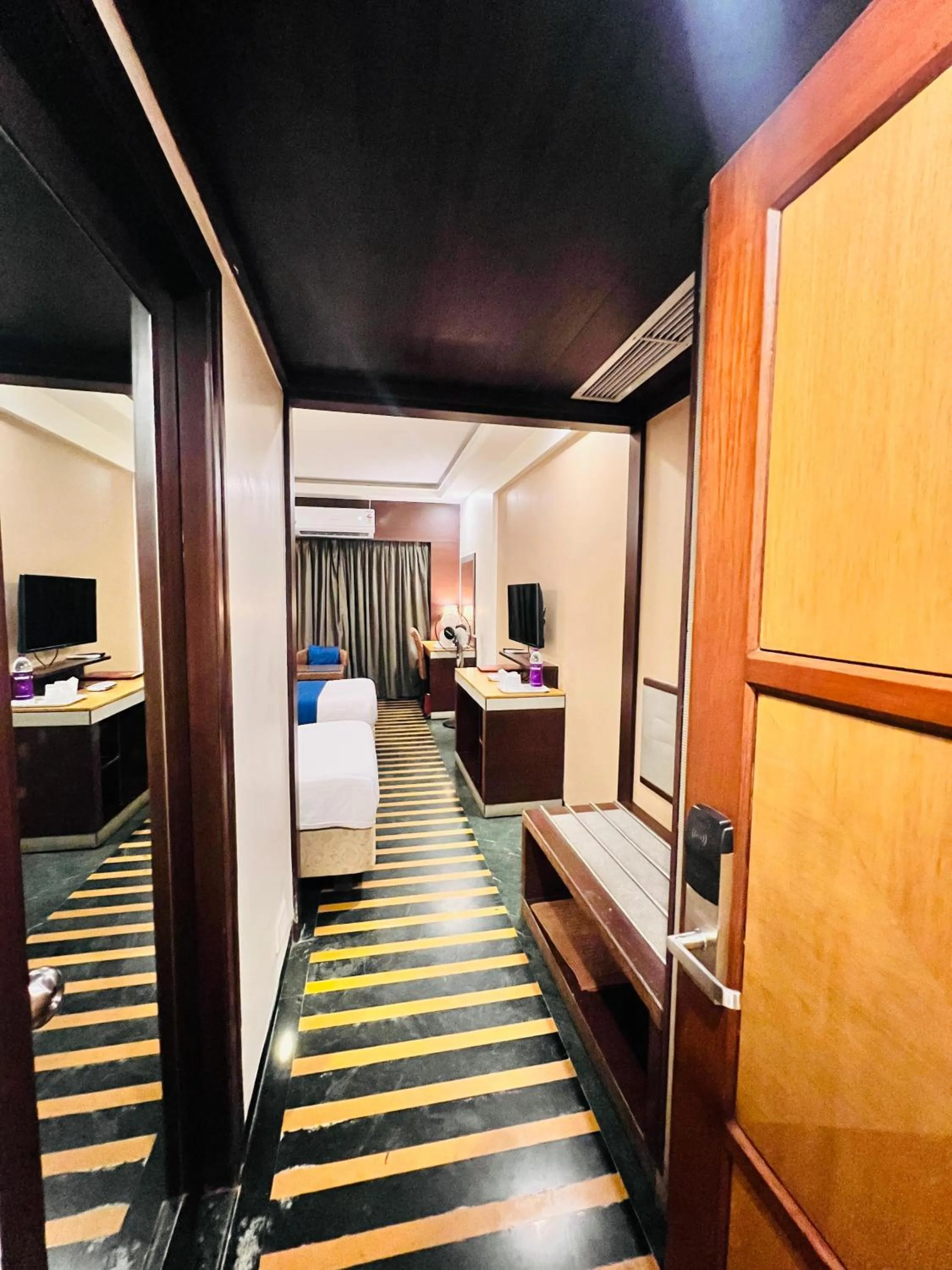 Communal lounge/ TV room, Bed in Hotel Dr Rajkumar International