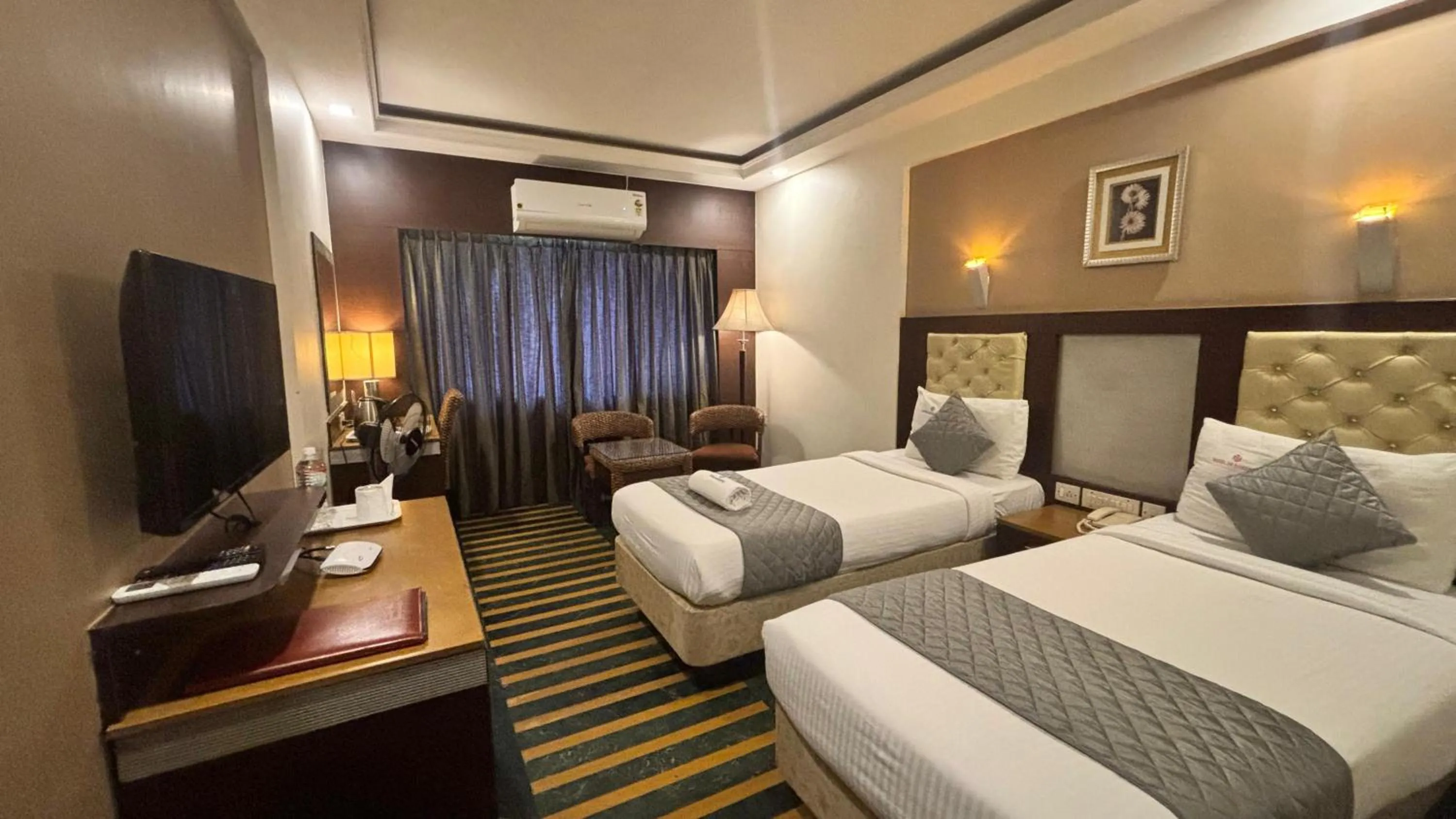 Bed in Hotel Dr Rajkumar International