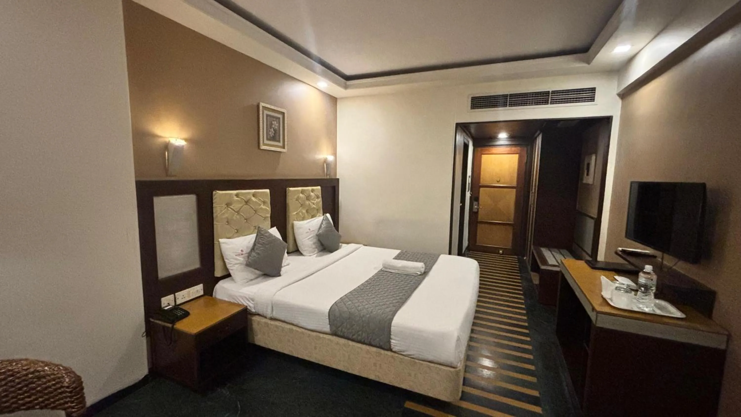 Bed in Hotel Dr Rajkumar International