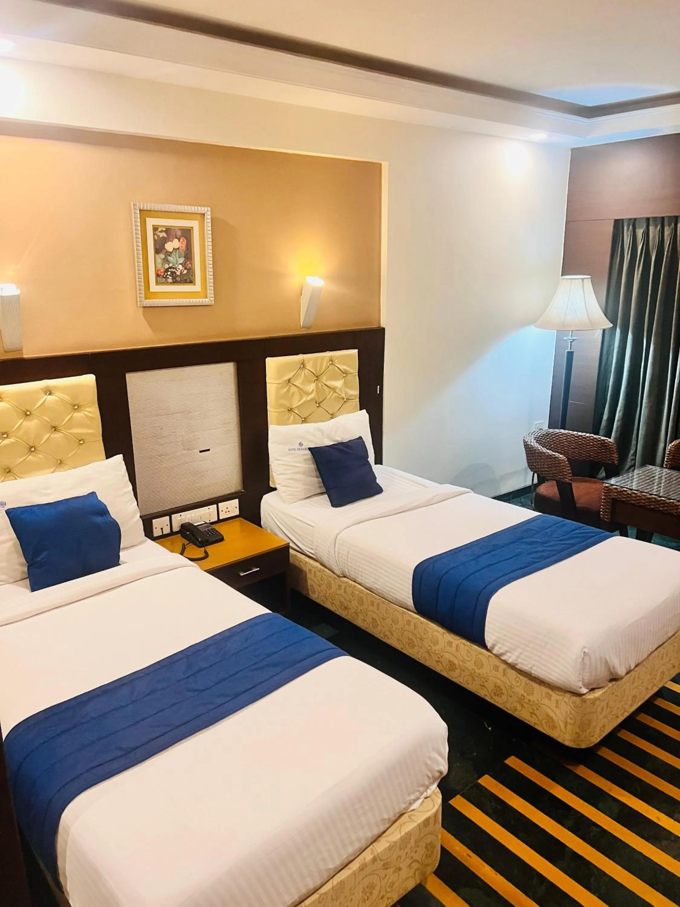 Bed in Hotel Dr Rajkumar International