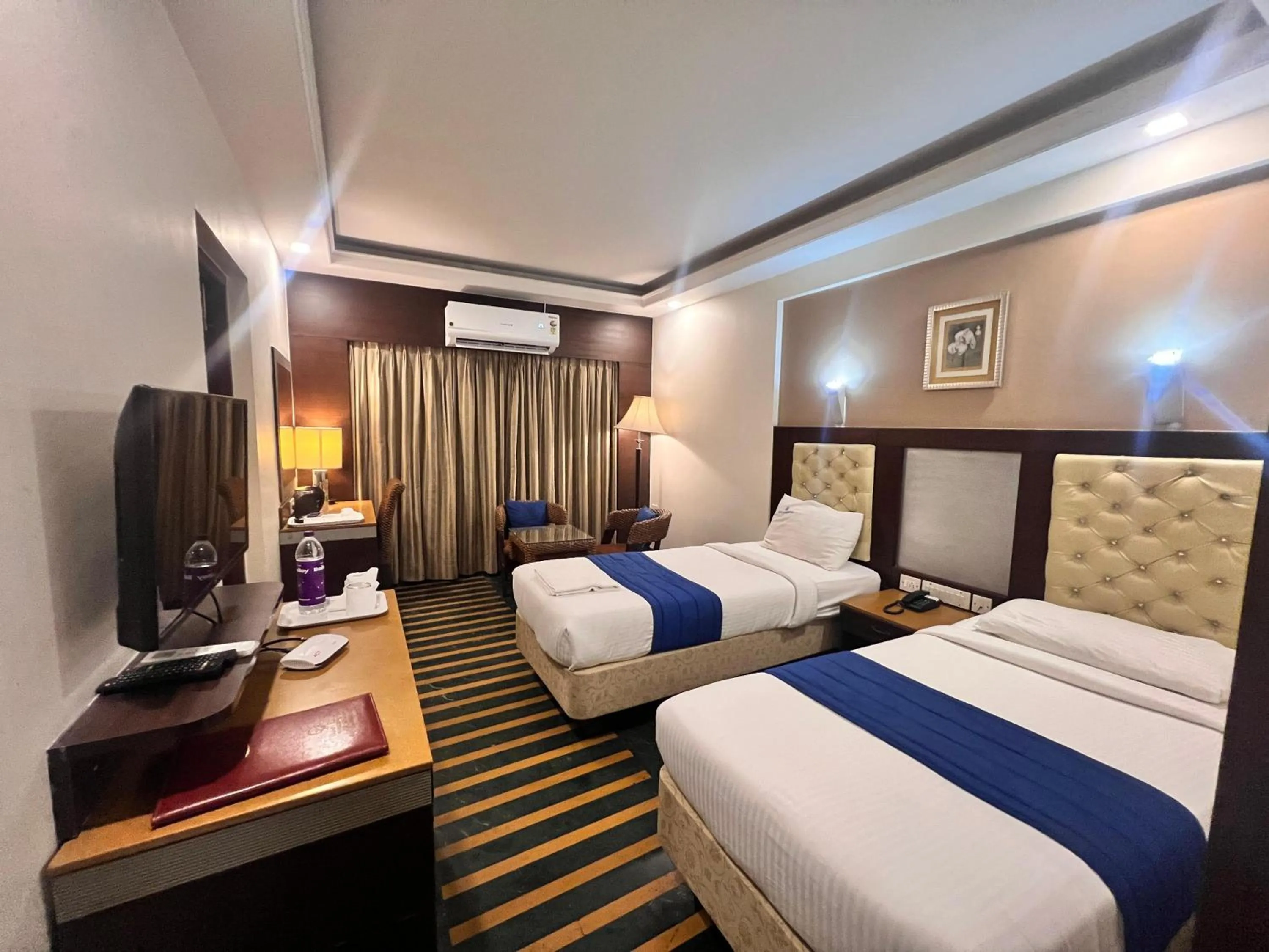 Communal lounge/ TV room, Bed in Hotel Dr Rajkumar International