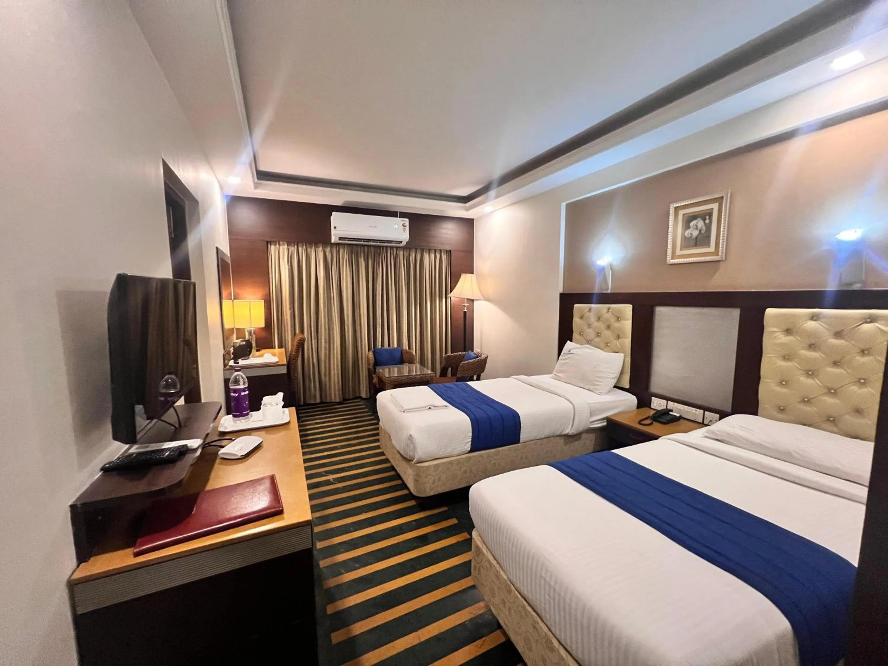 Bed in Hotel Dr Rajkumar International