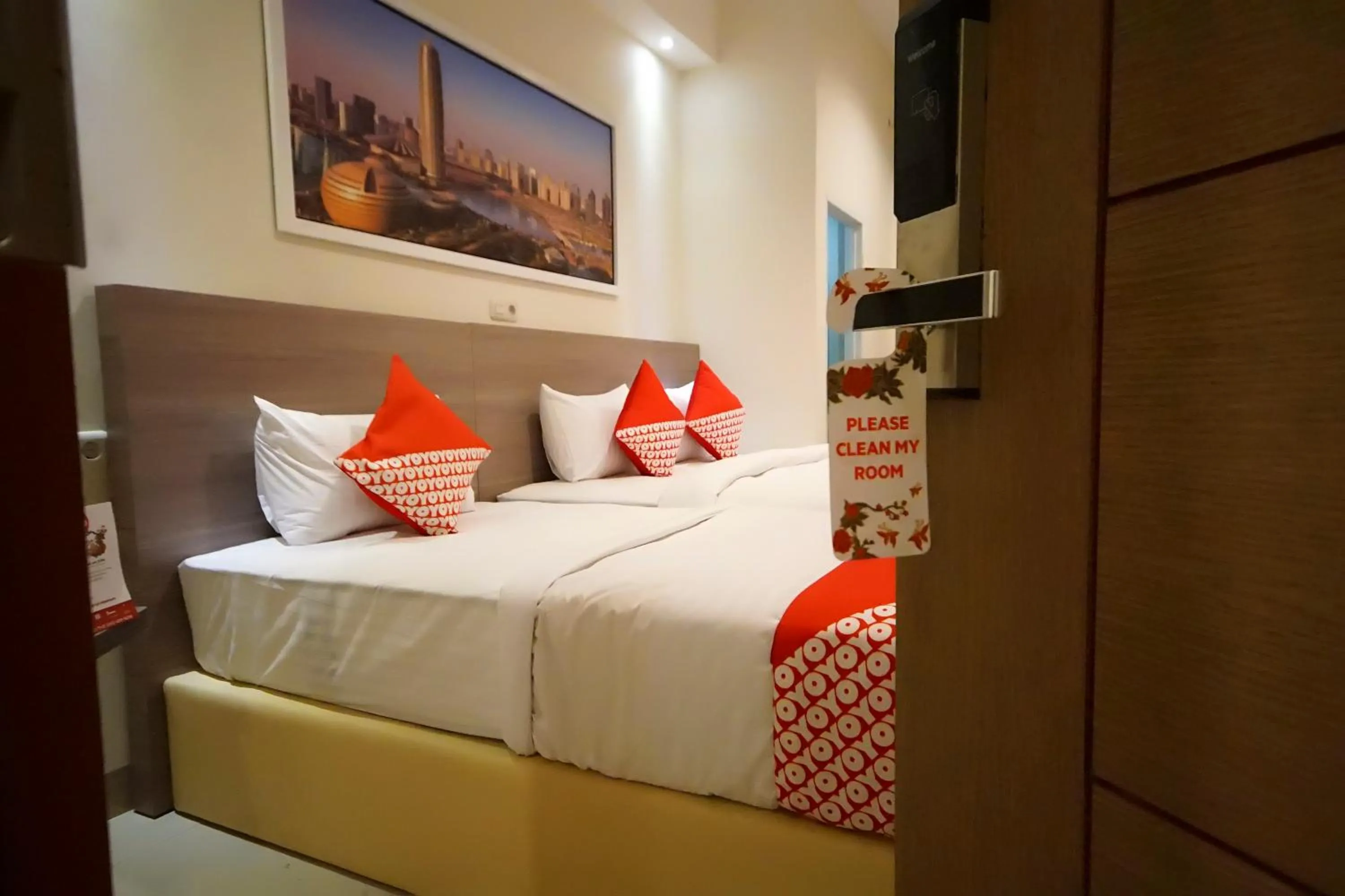 Bedroom in OYO 251 The Maximus Inn Hotel