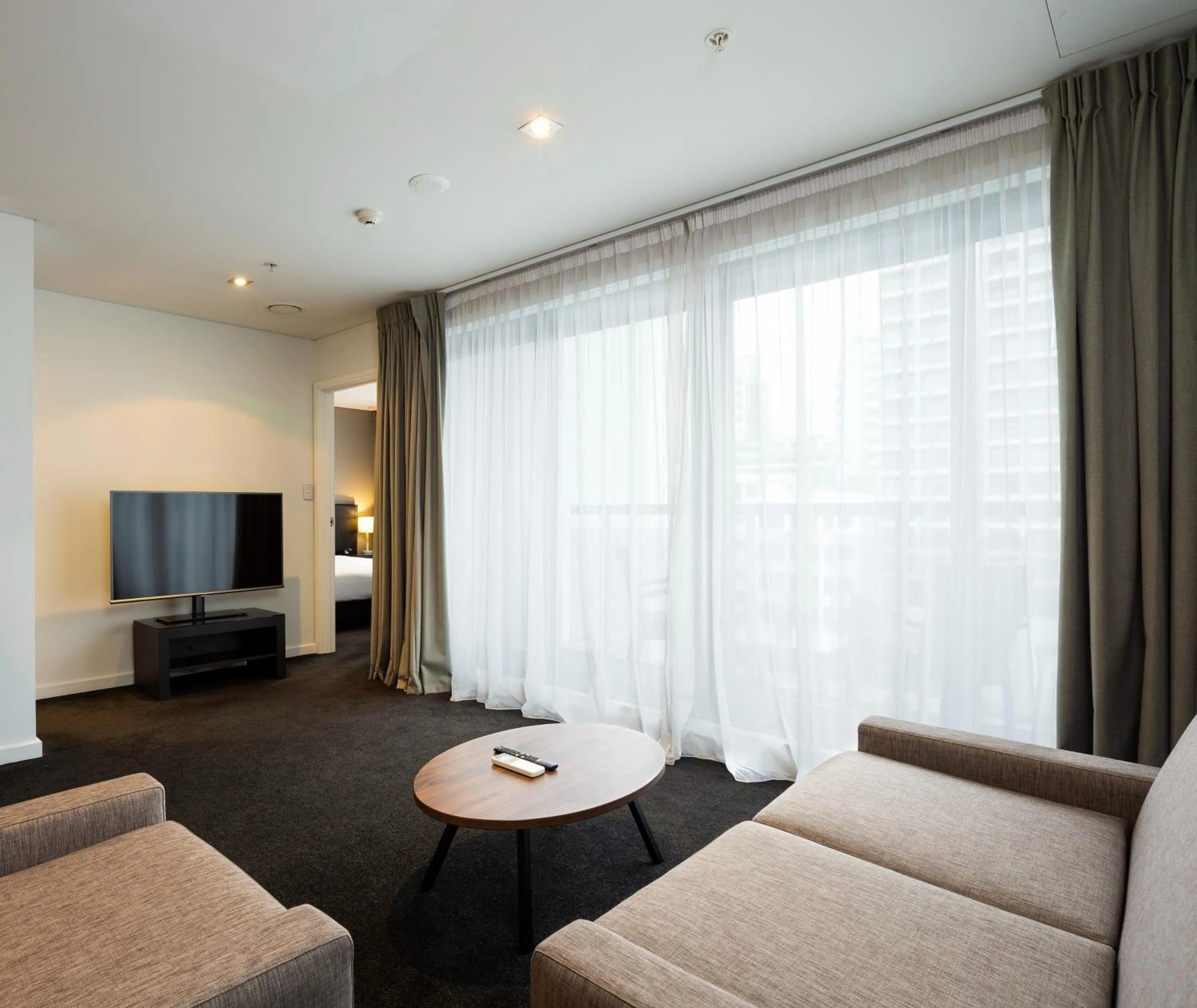 Living room in Oaks Auckland Hotel