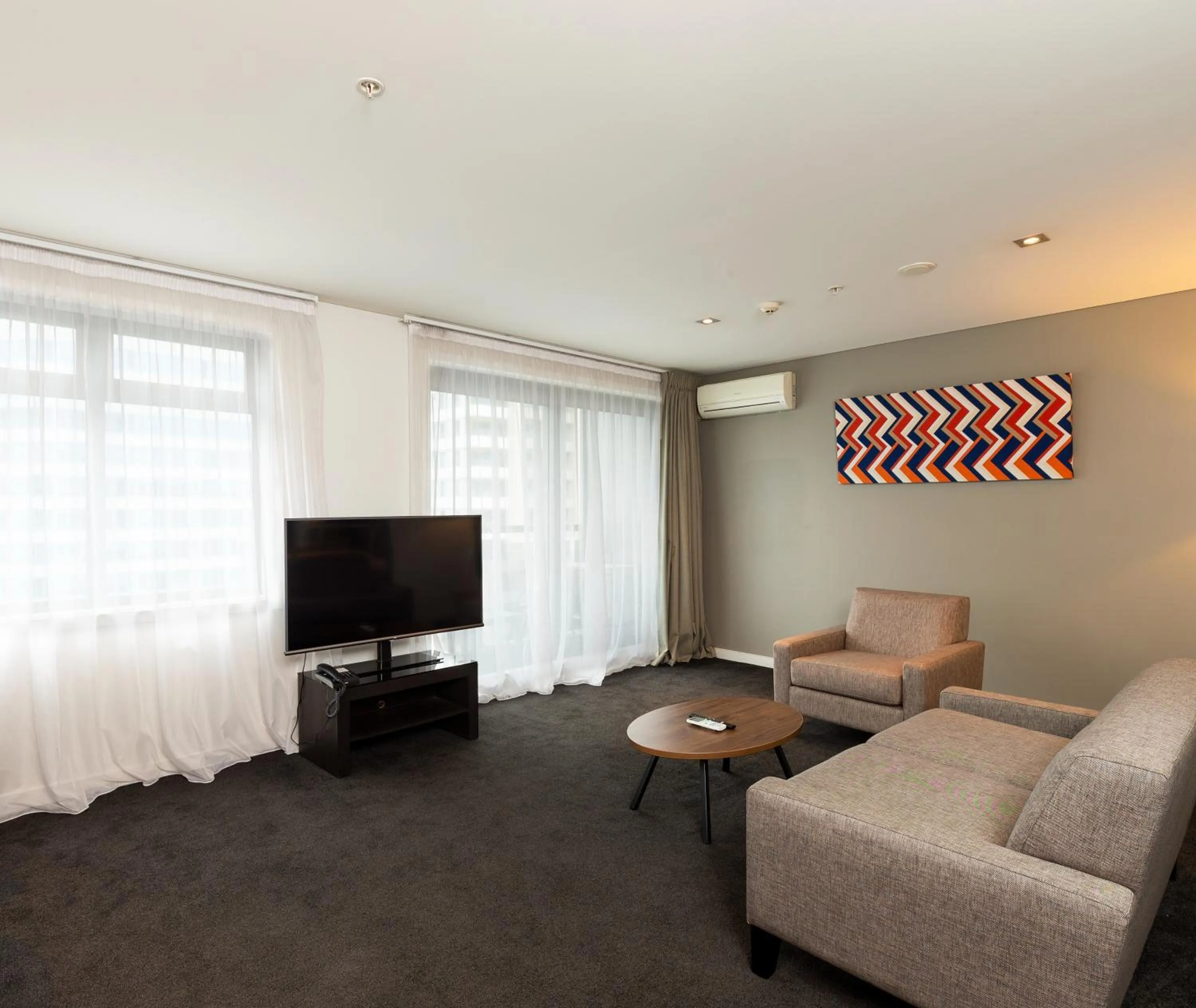 Living room in Oaks Auckland Hotel