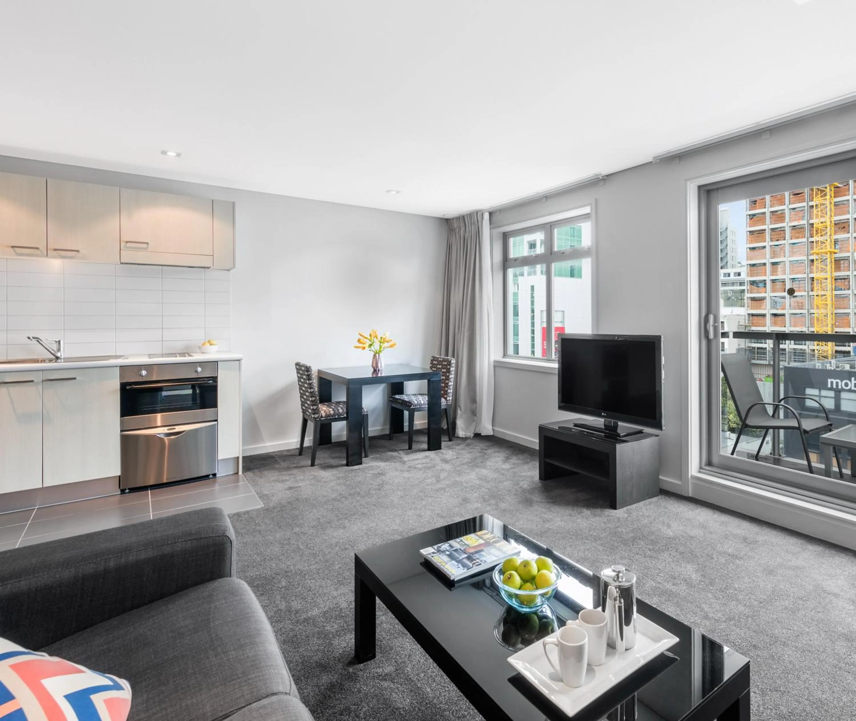 Living room in Oaks Auckland Hotel