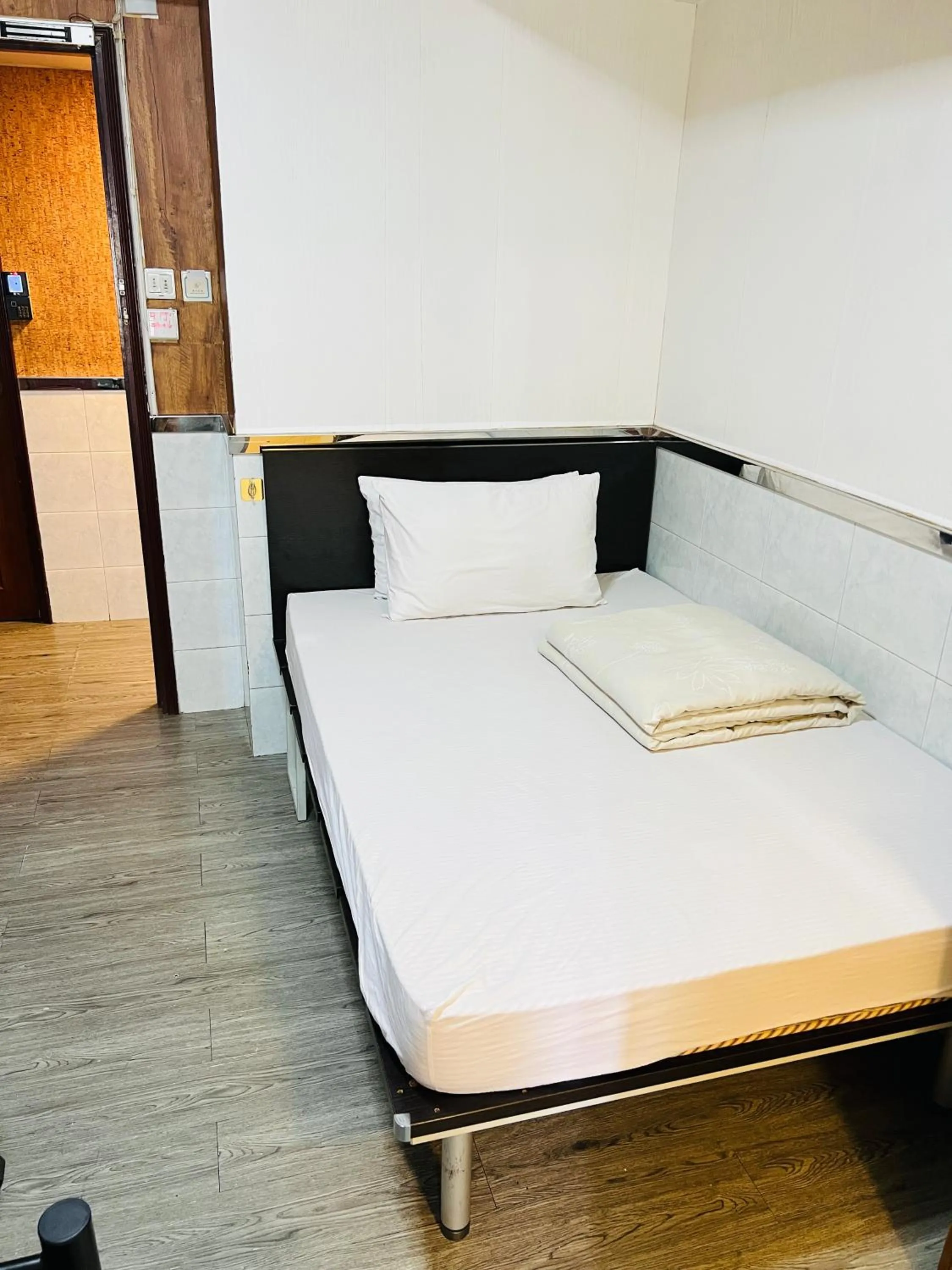 Bed in 嘉應賓館HAKKAS GUEST House