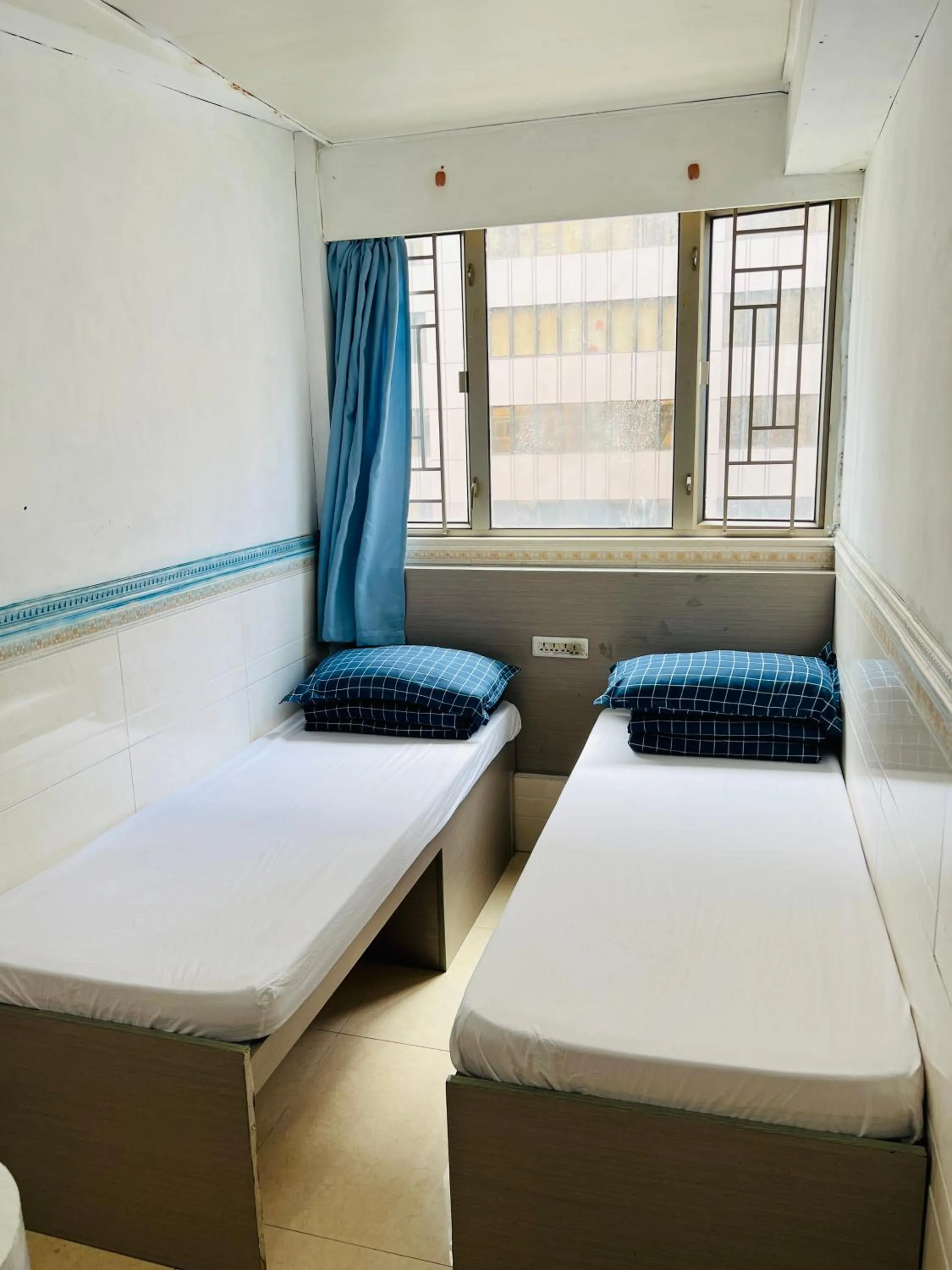 Bed in 嘉應賓館HAKKAS GUEST House