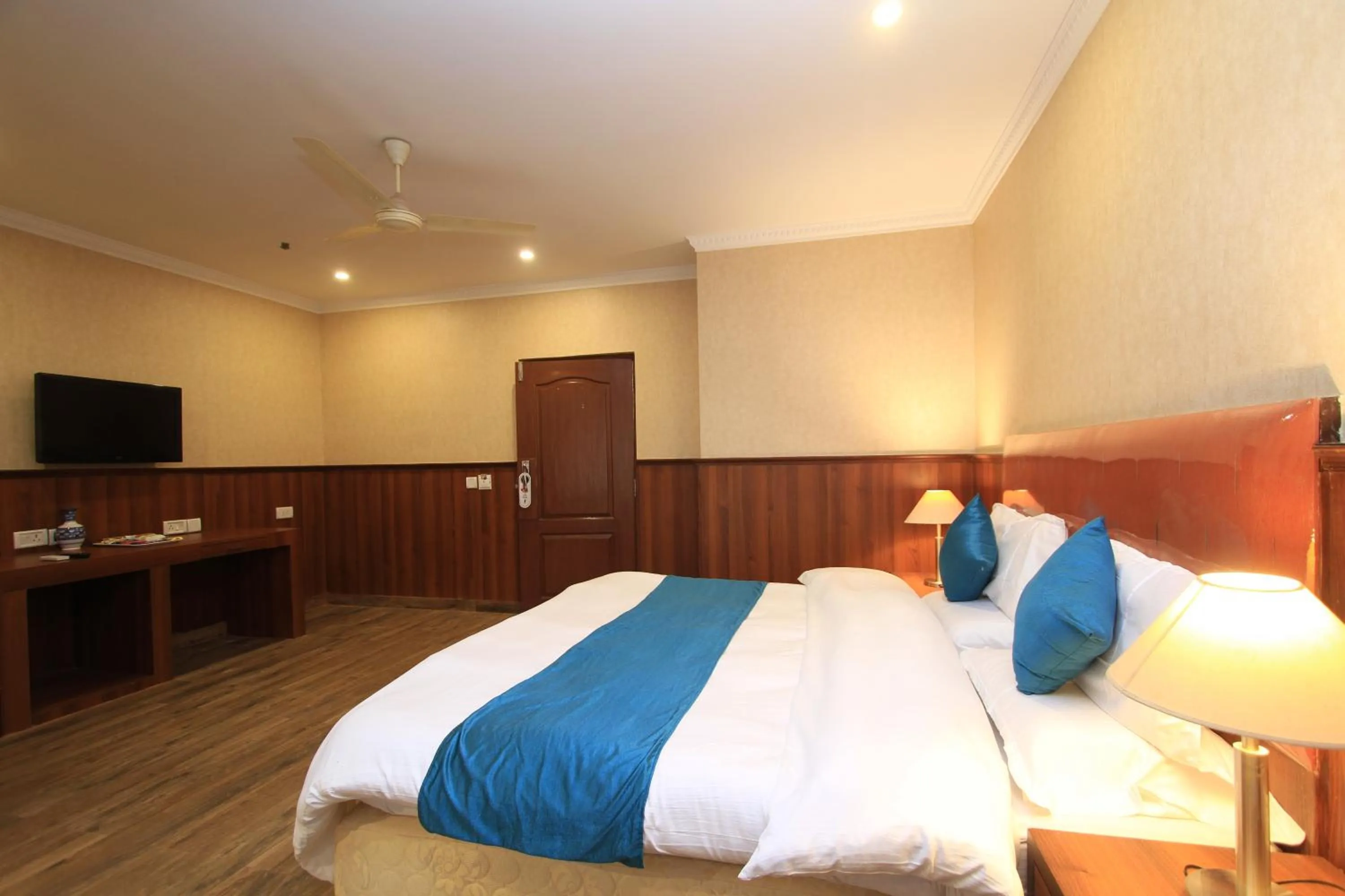 Bed in Hotel Noor Empire International Kormangala