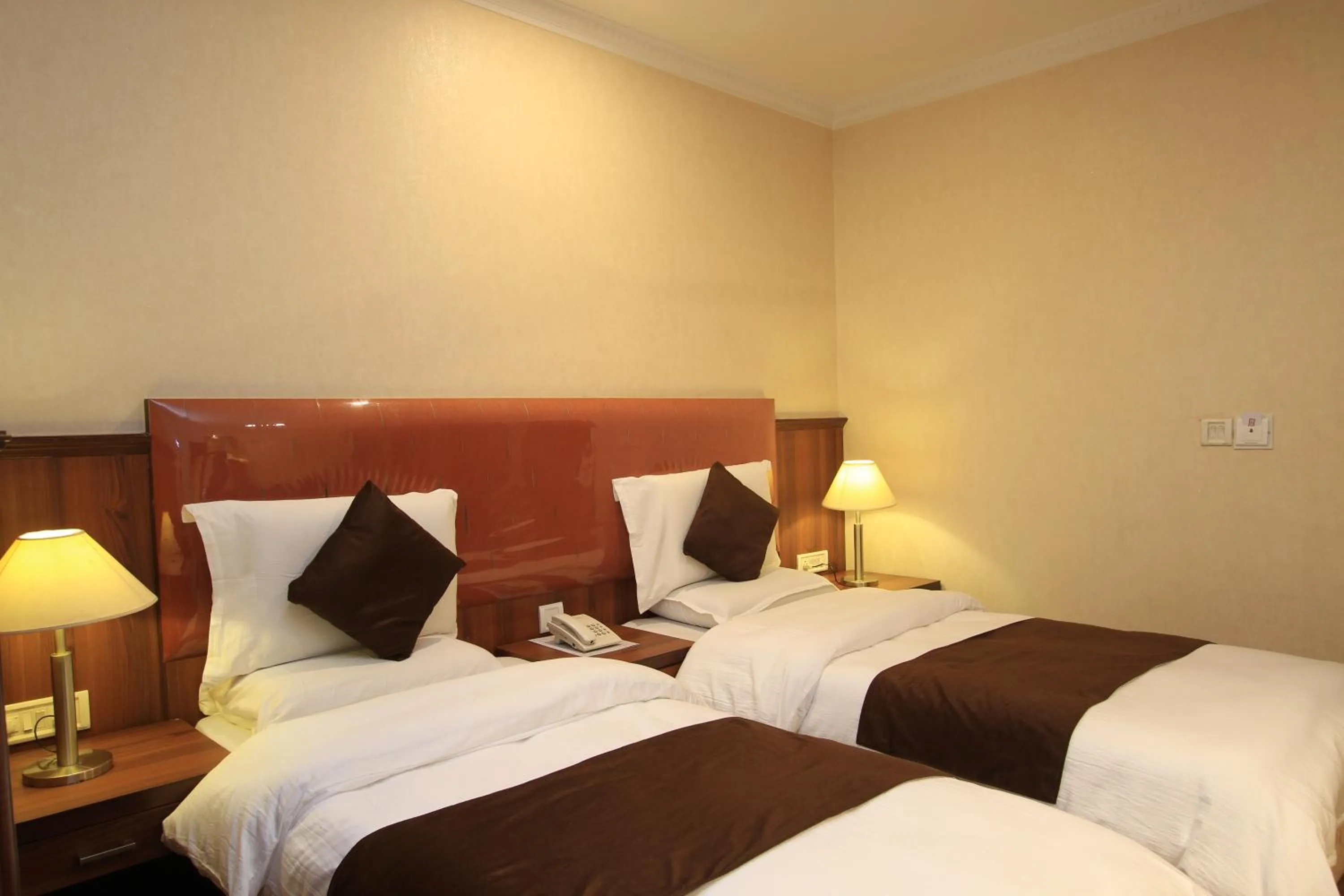 Bed in Hotel Noor Empire International Kormangala