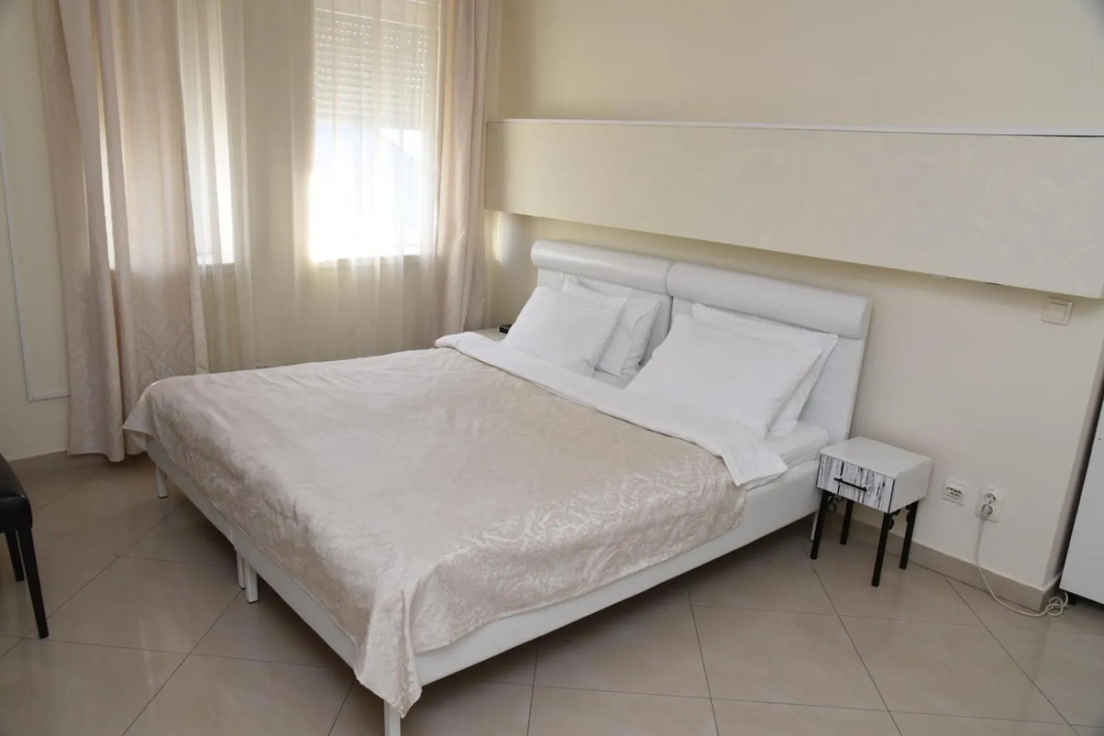 Bed in Garni Hotel Dash