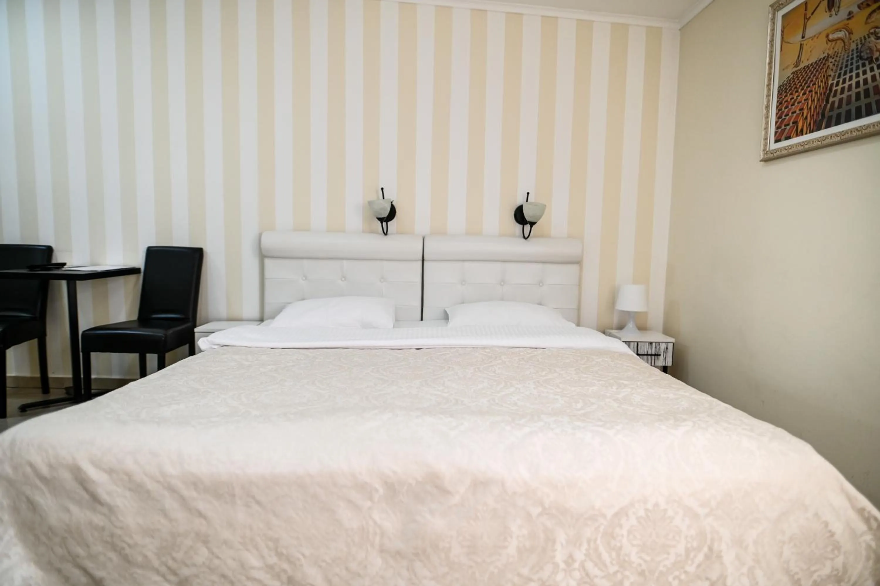 Bed in Garni Hotel Dash